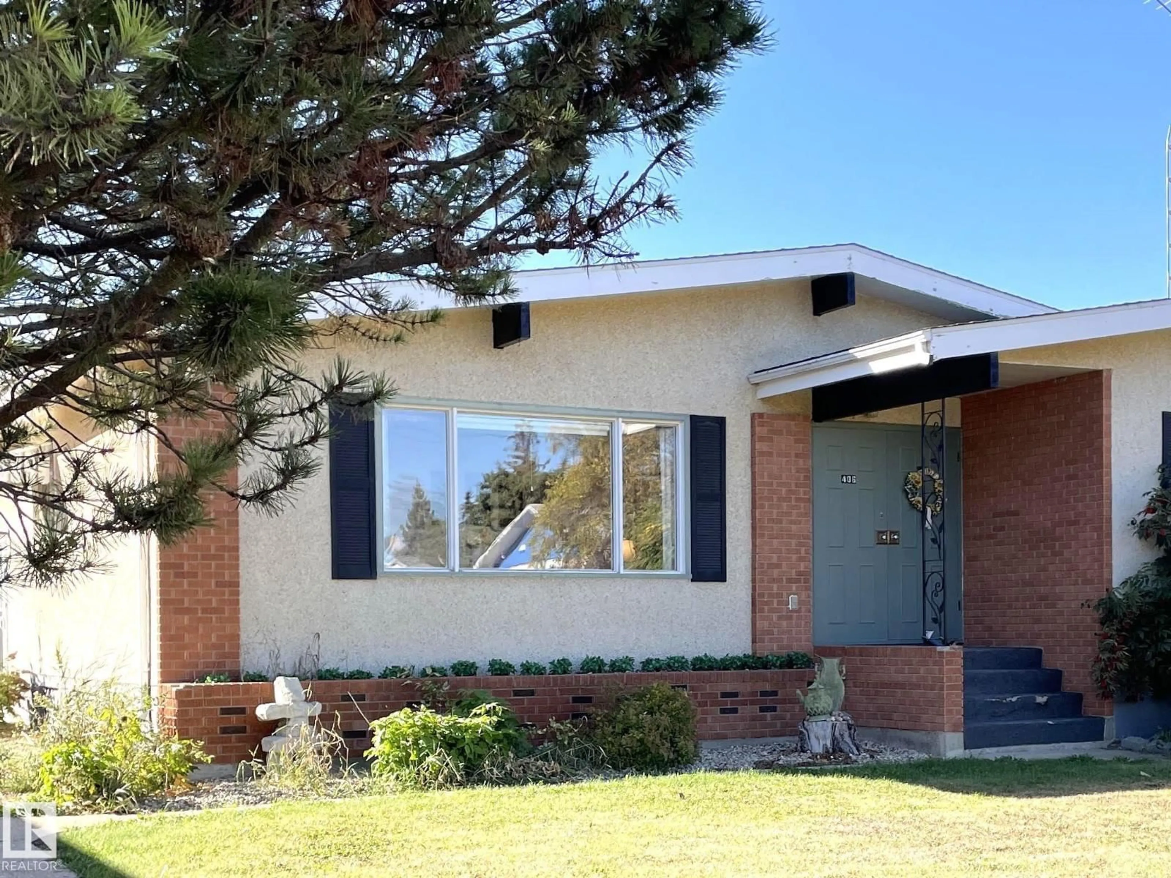 Home with brick exterior material, street for 406 6 ST, Thorhild Alberta T0A3J0