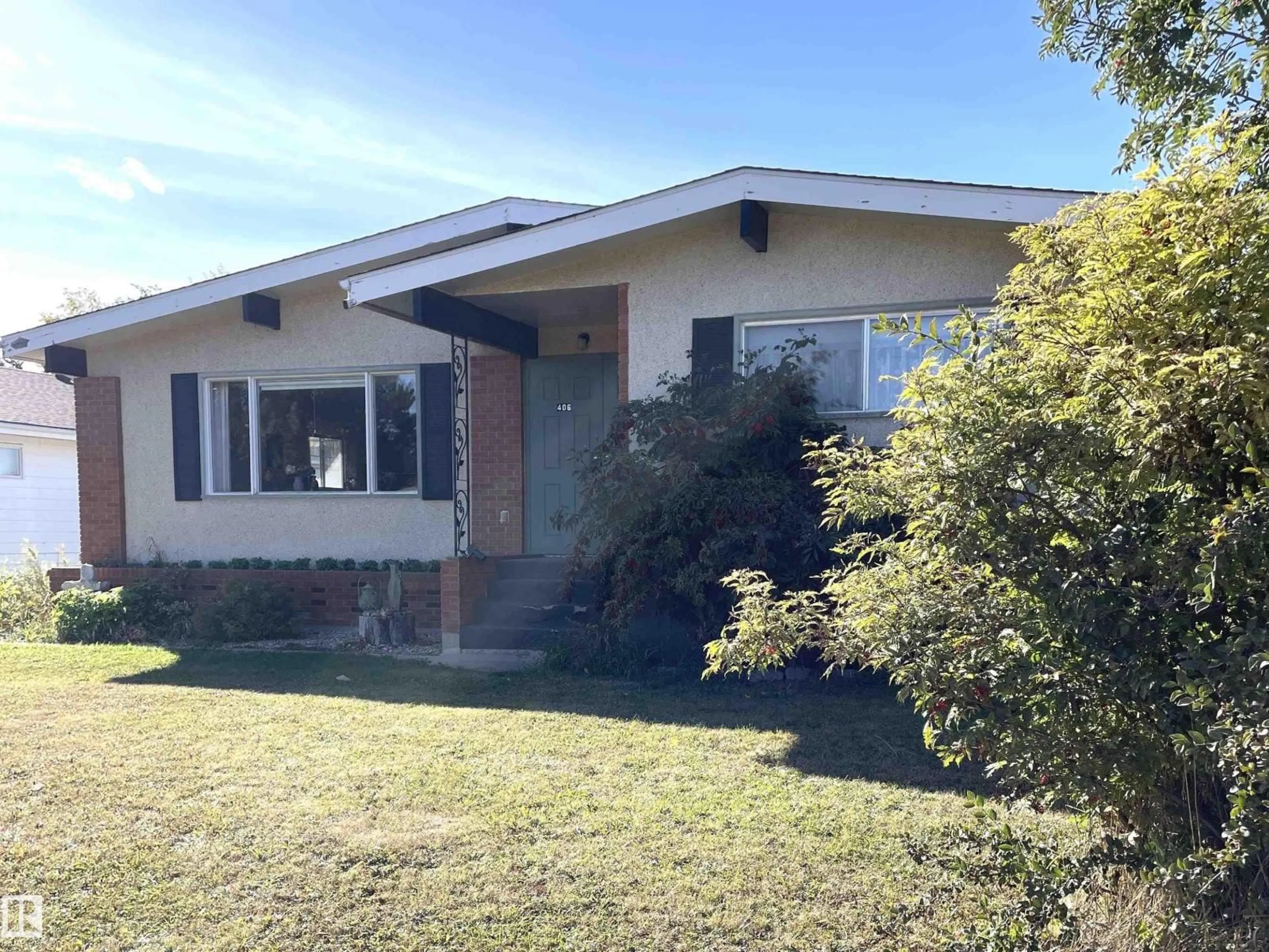 Home with vinyl exterior material, street for 406 6 ST, Thorhild Alberta T0A3J0