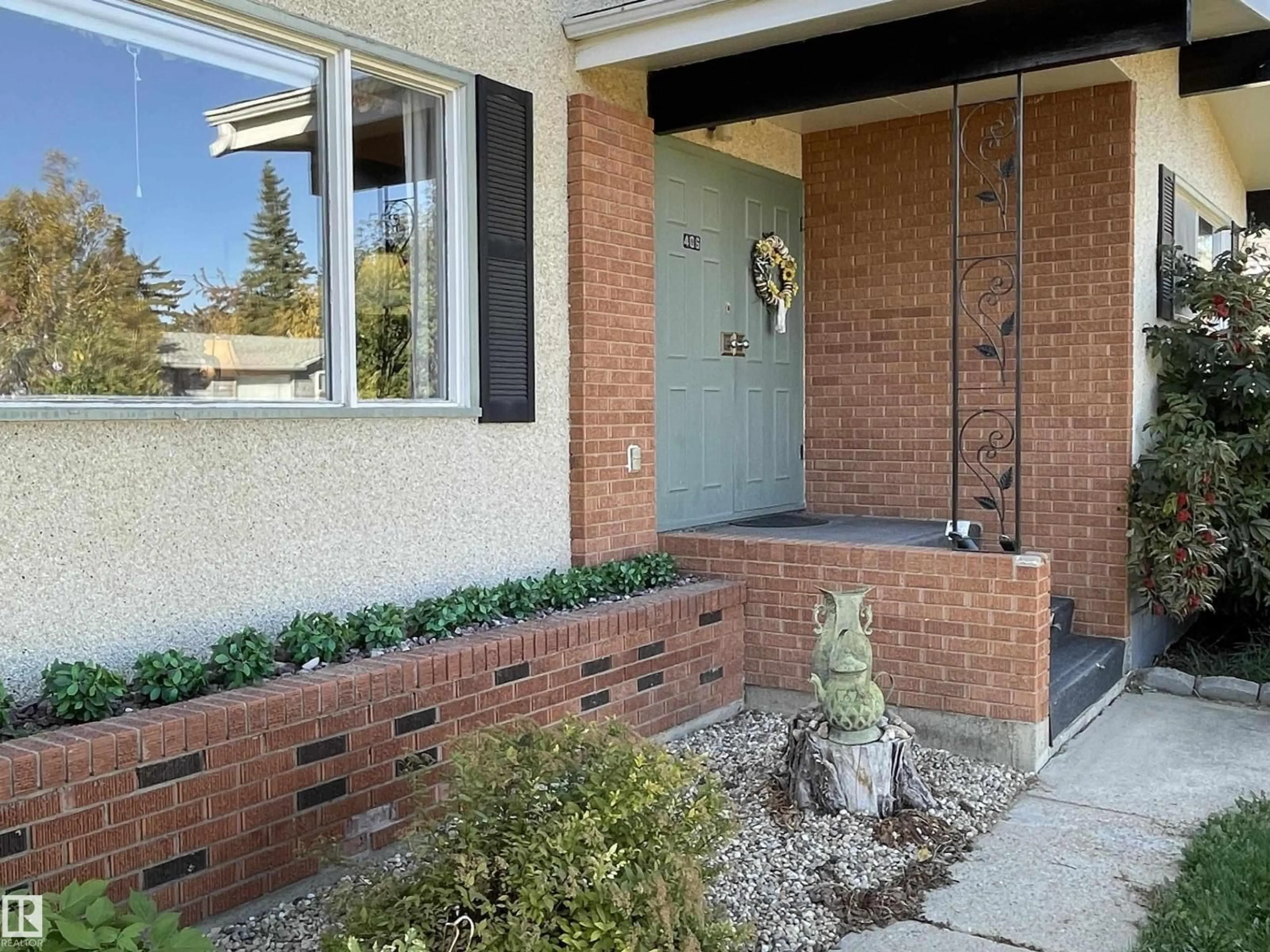 Home with brick exterior material, street for 406 6 ST, Thorhild Alberta T0A3J0