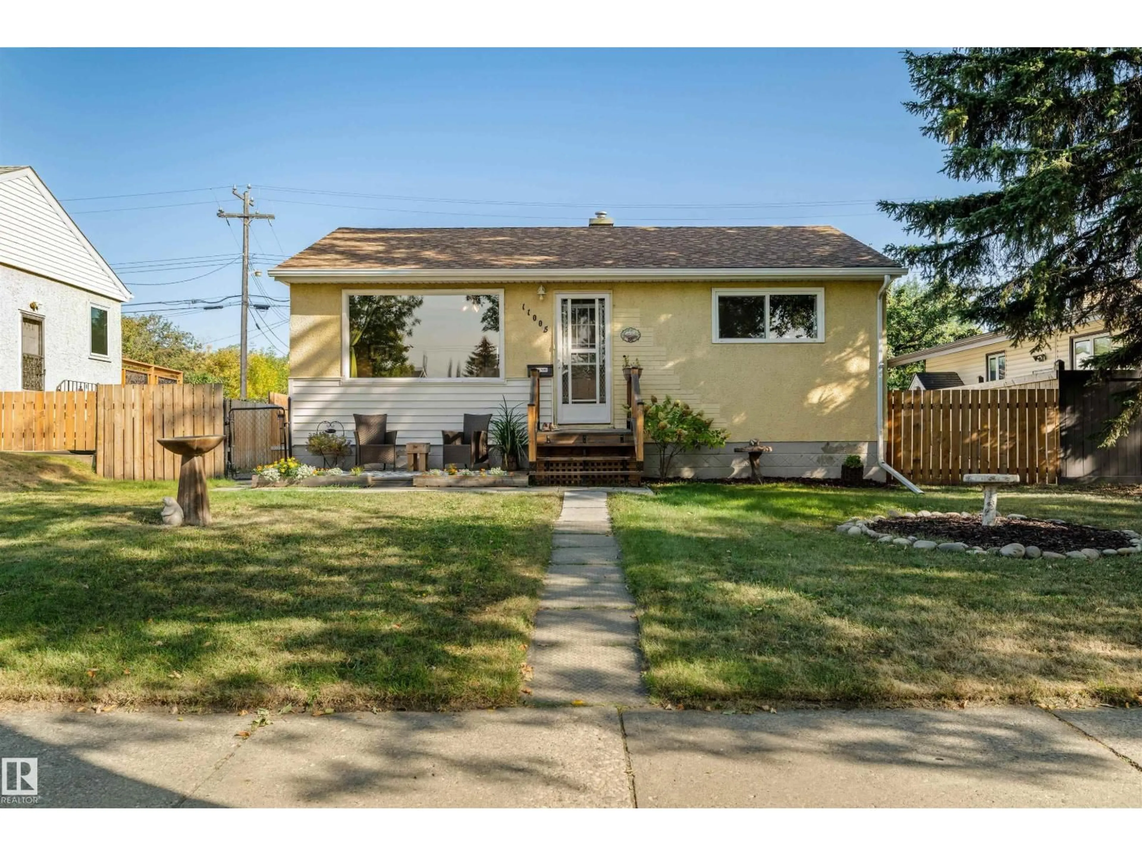 Home with vinyl exterior material, street for 11005 38 ST, Edmonton Alberta T5W2E7