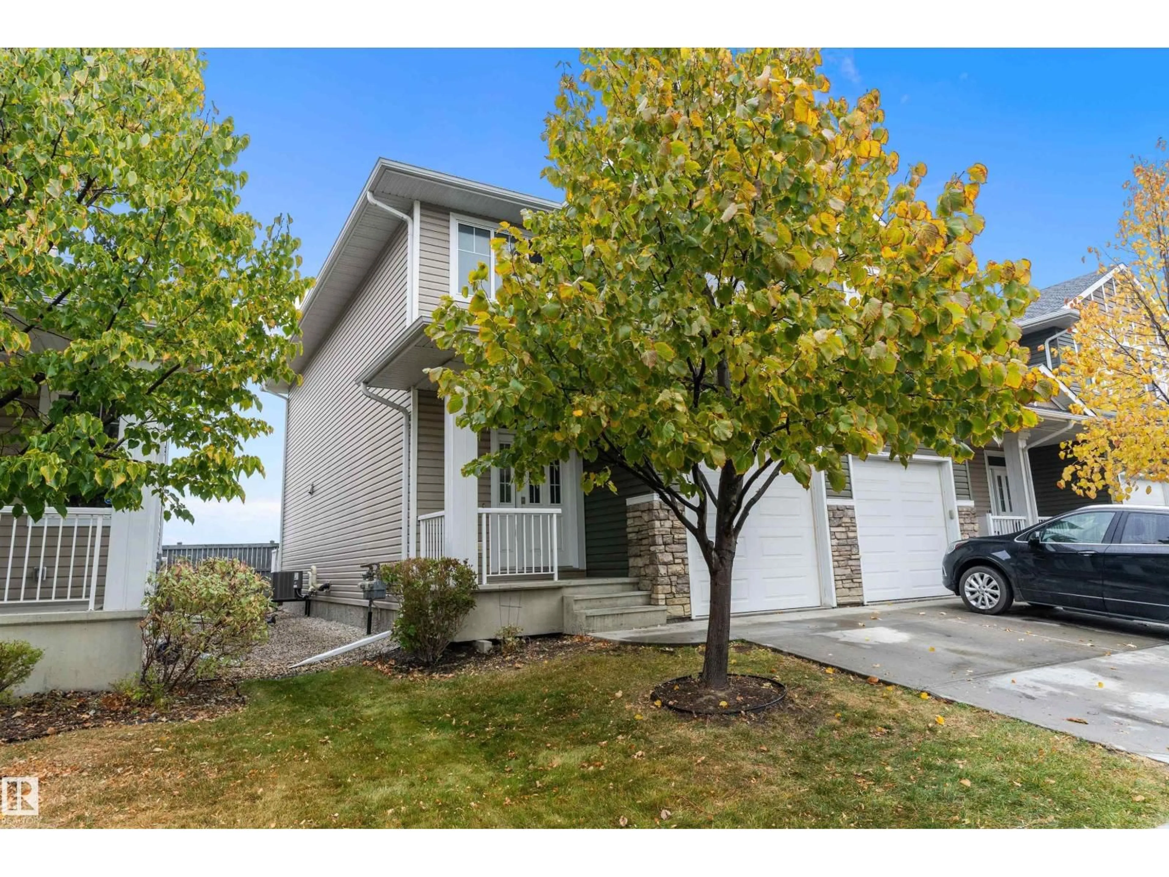 Home with vinyl exterior material, street for 39 18230 104A ST NW, Edmonton Alberta T5X0G9
