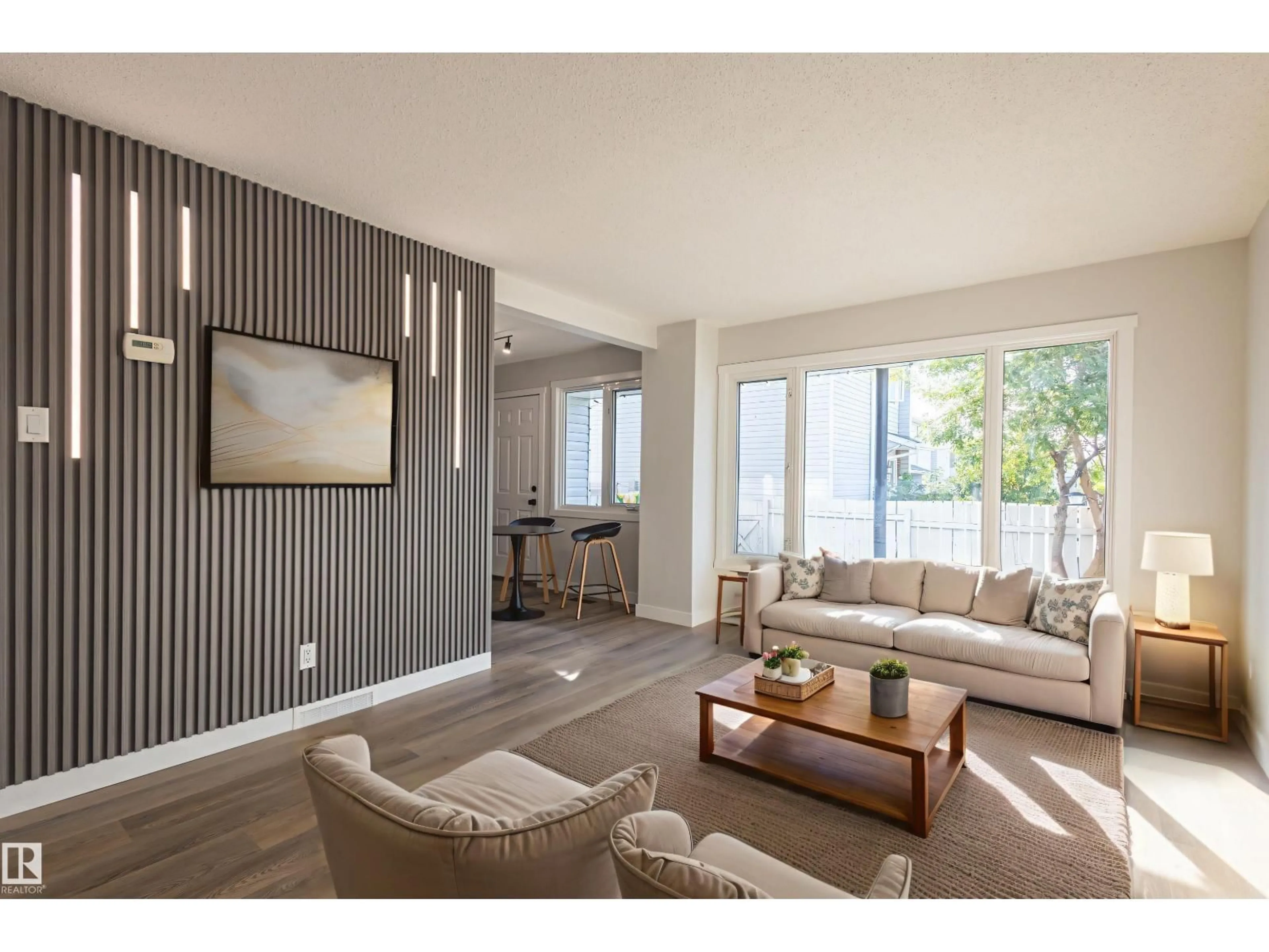 Living room with furniture, wood/laminate floor for 62 AMBERLY CO, Edmonton Alberta T5A0H9