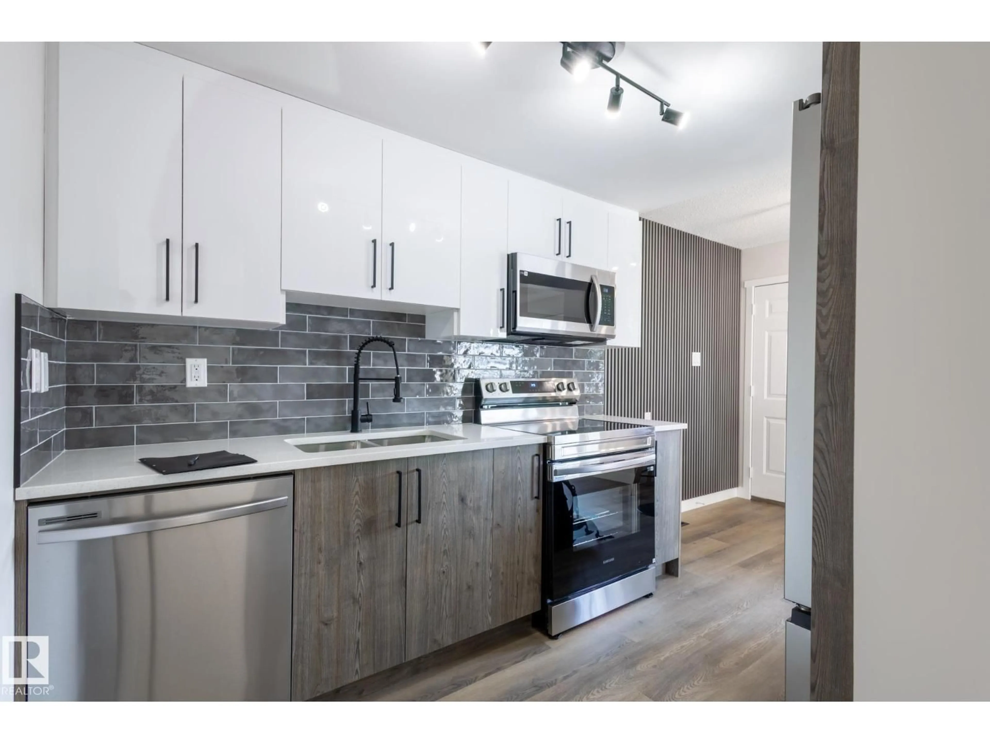 Open concept kitchen, wood/laminate floor for 62 AMBERLY CO, Edmonton Alberta T5A0H9