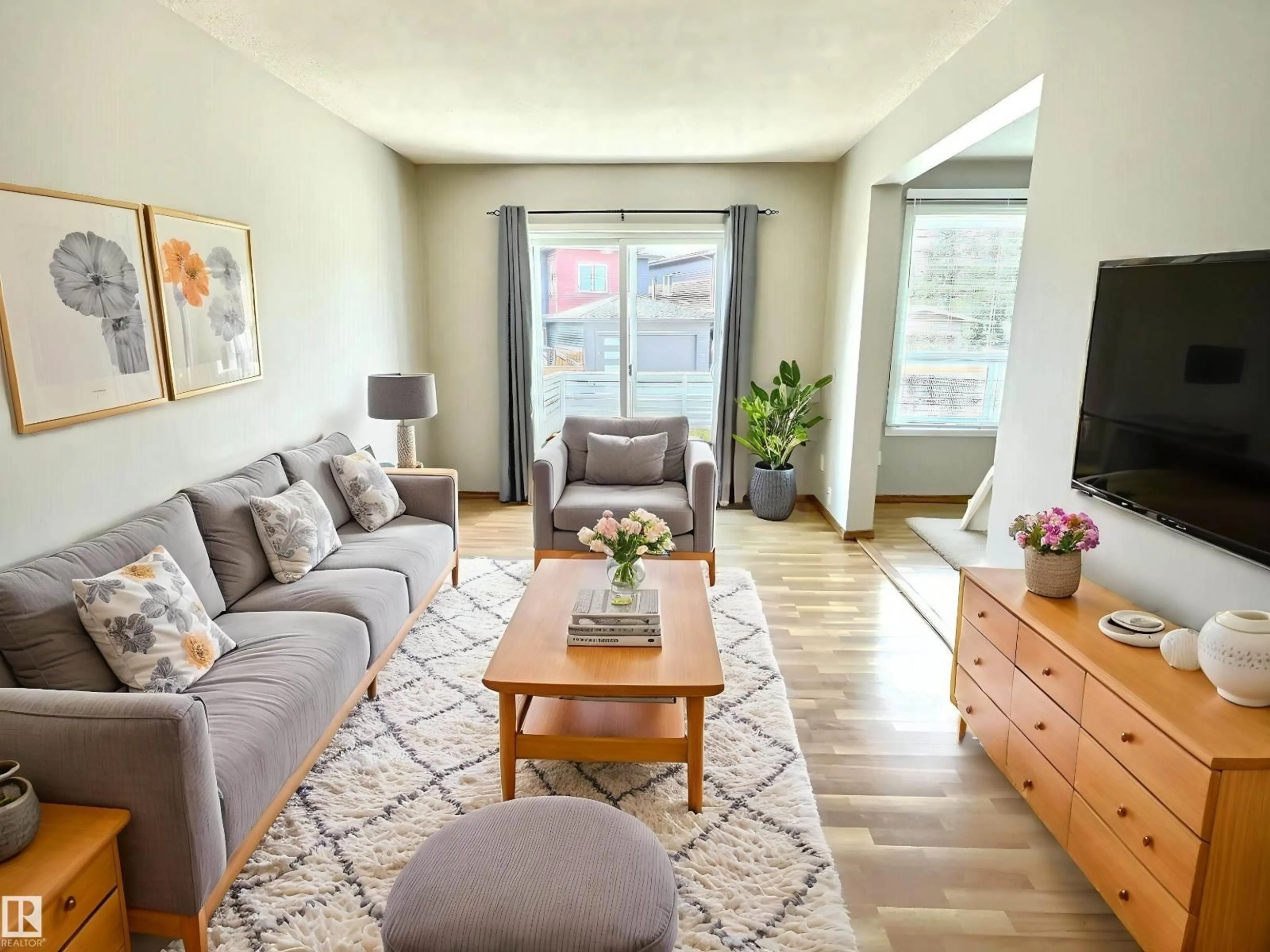 Living room with furniture, wood/laminate floor for NW - 2206 38 ST, Edmonton Alberta T6L4C3