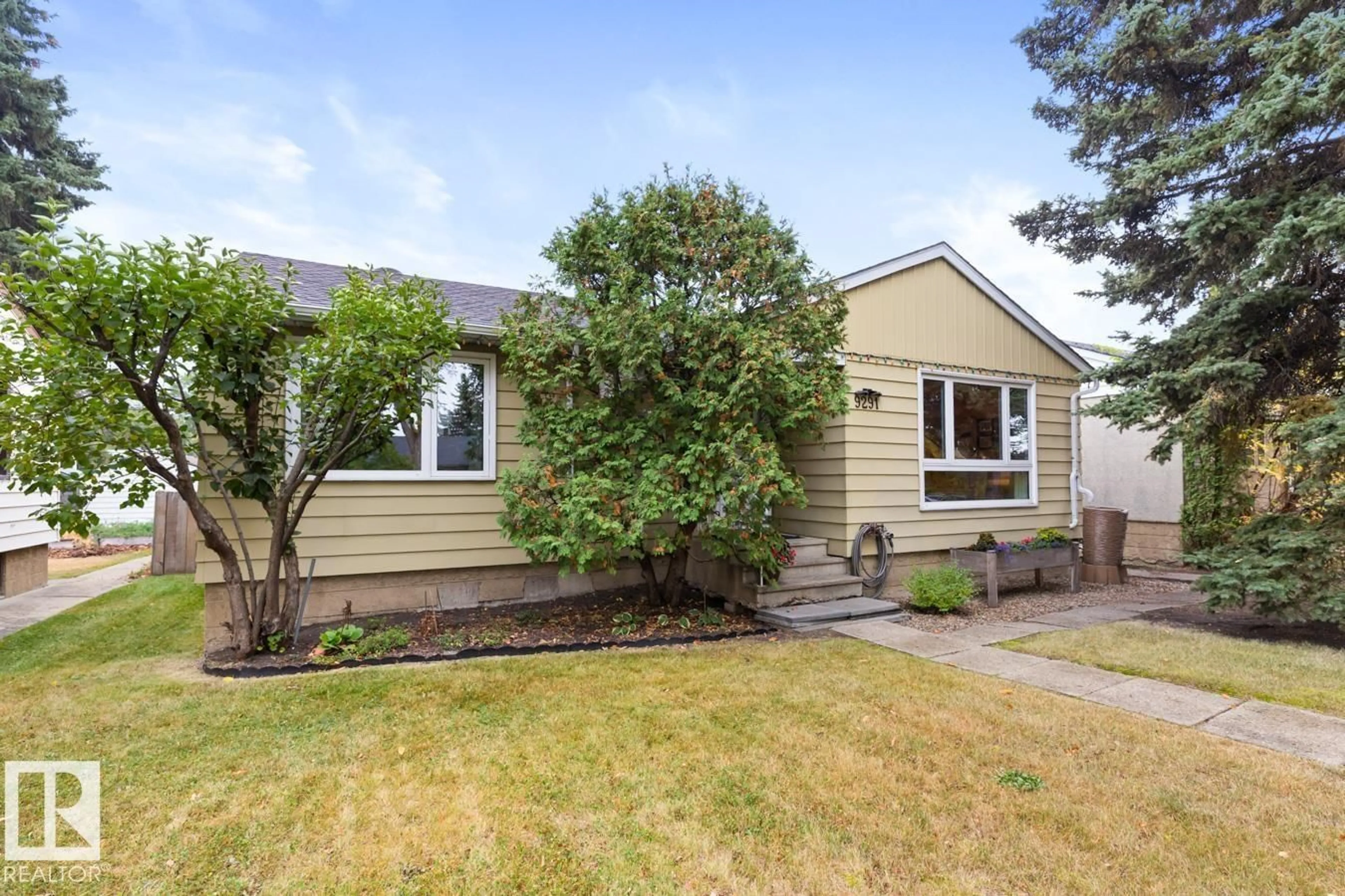 Home with vinyl exterior material, street for 9291 79 ST, Edmonton Alberta T6C2R6