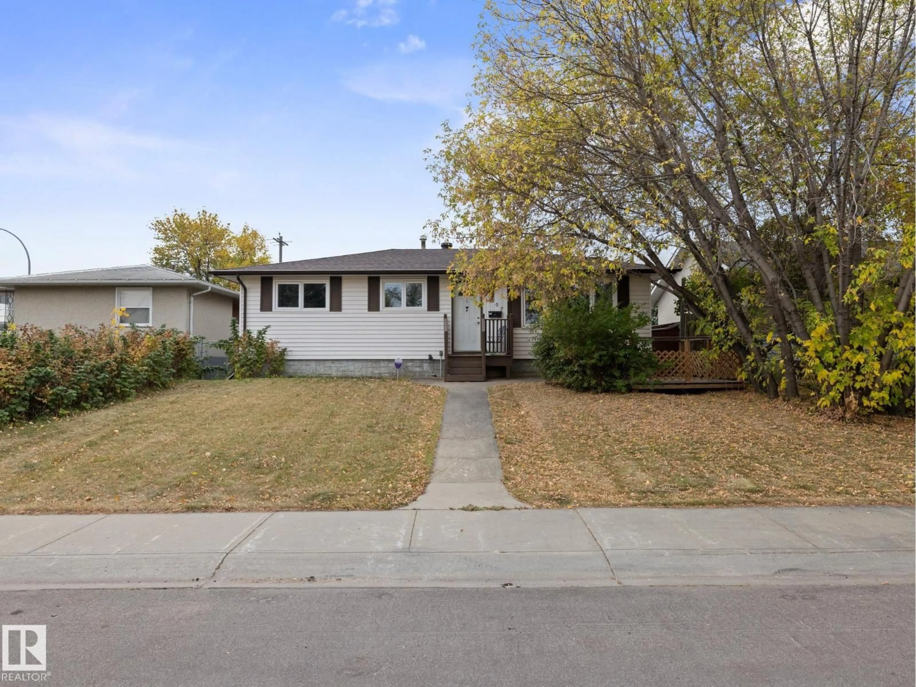 Home with vinyl exterior material, street for 13207 133 AV, Edmonton Alberta T6V1A8