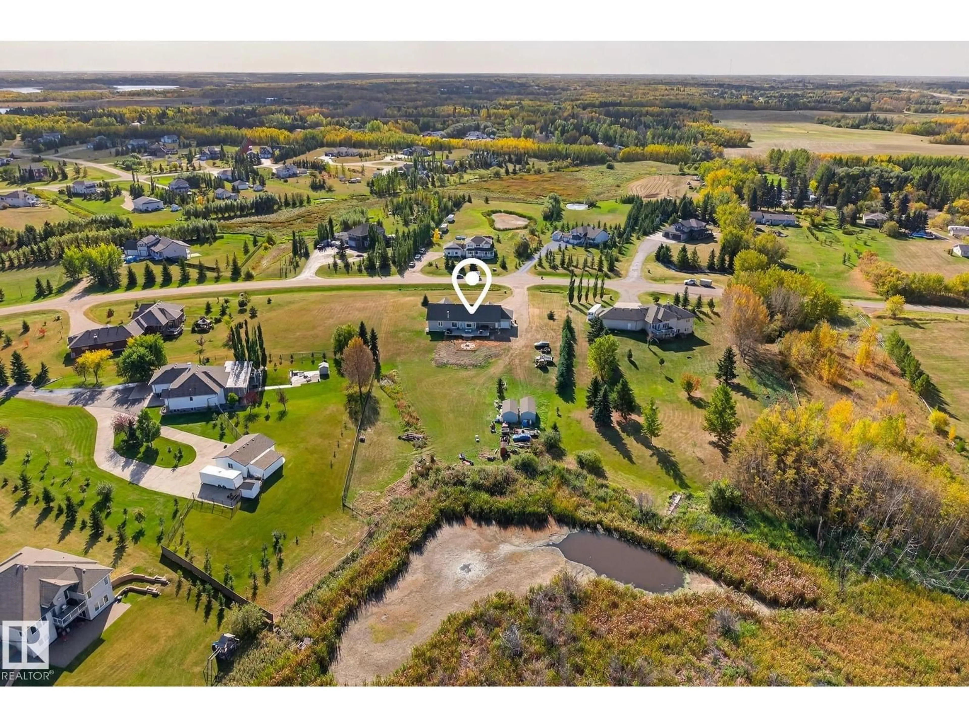 A pic from outside/outdoor area/front of a property/back of a property/a pic from drone, water/lake/river/ocean view for 470 52358 RGE ROAD 225, Rural Strathcona County Alberta T8C1C7