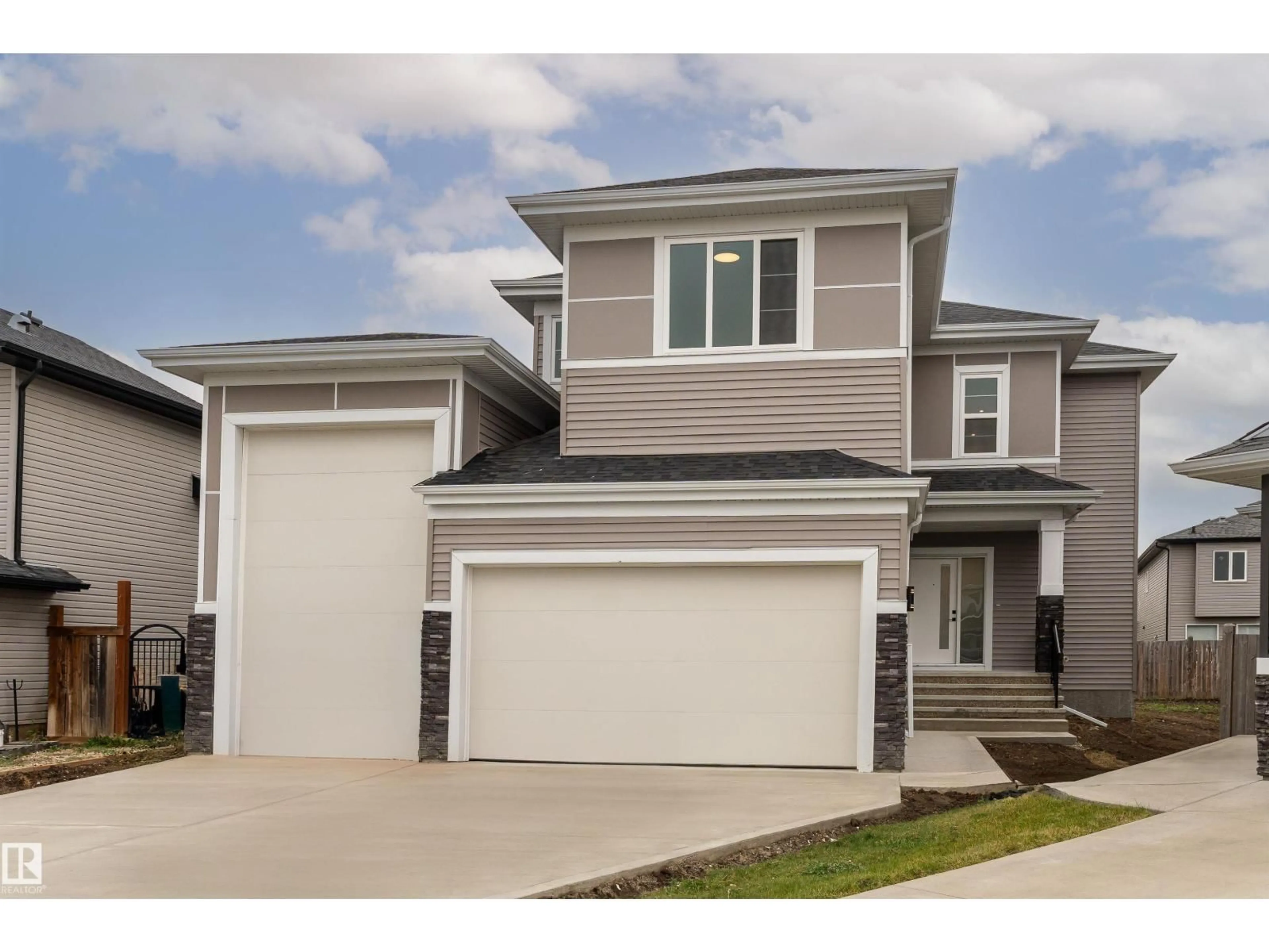 Home with vinyl exterior material, street for 73 LANDING TRAILS DR, Gibbons Alberta T0A1N0