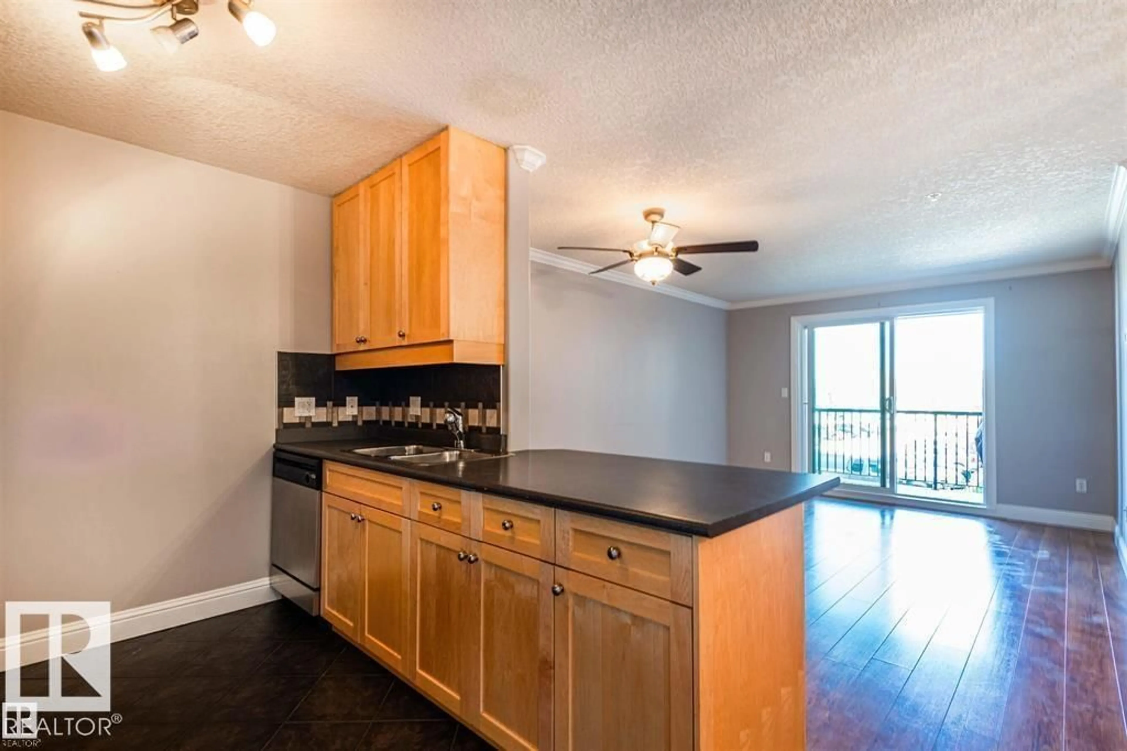 Open concept kitchen, wood/laminate floor for 215 13111 140 AV NW, Edmonton Alberta T6V0B1