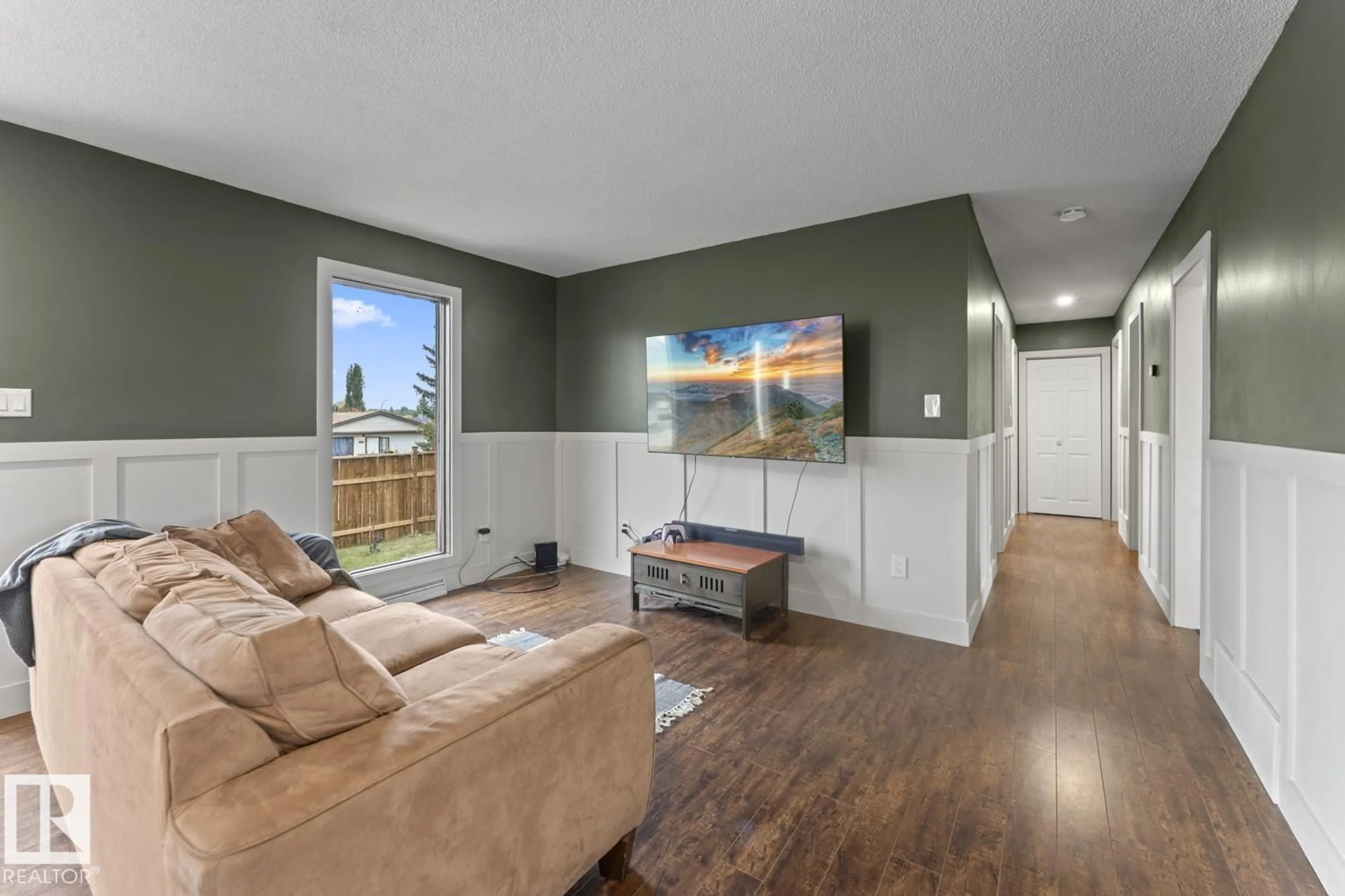 Living room with furniture, wood/laminate floor for 5213 56 ST, Cold Lake Alberta T9M1R2