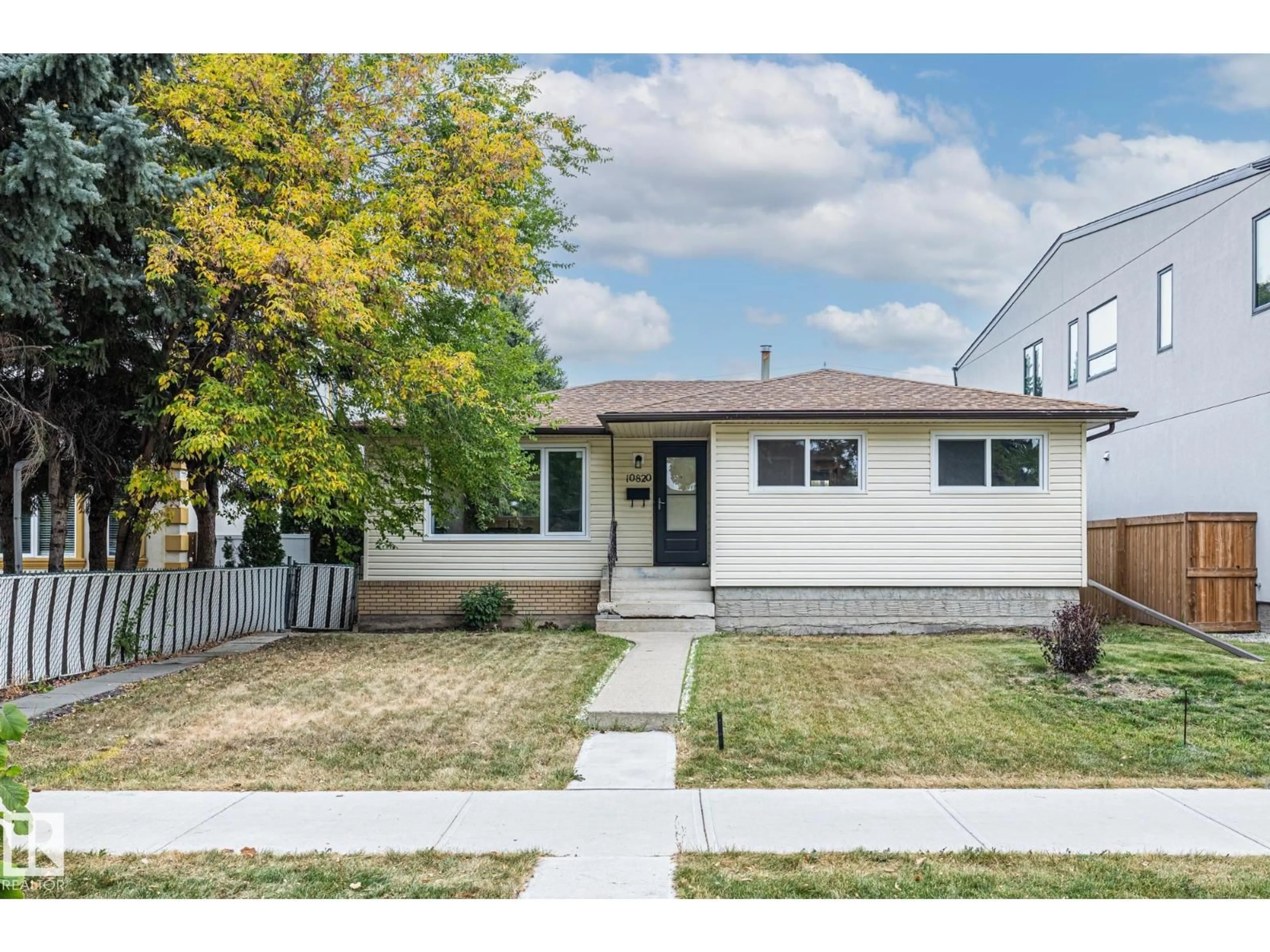 Home with vinyl exterior material, street for 10820 60 AV, Edmonton Alberta T6H4R1