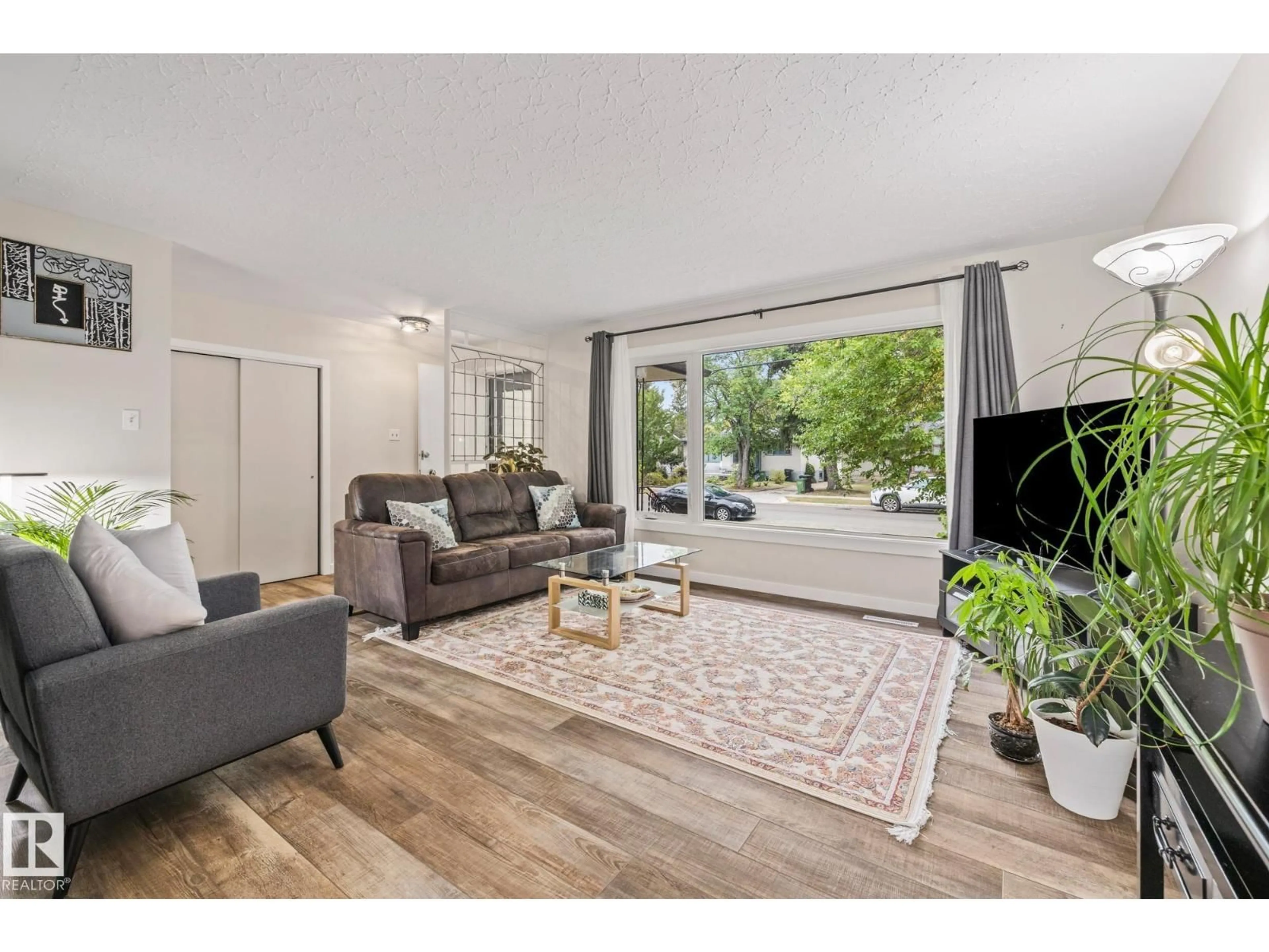 Living room with furniture, unknown for 10820 60 AV, Edmonton Alberta T6H4R1