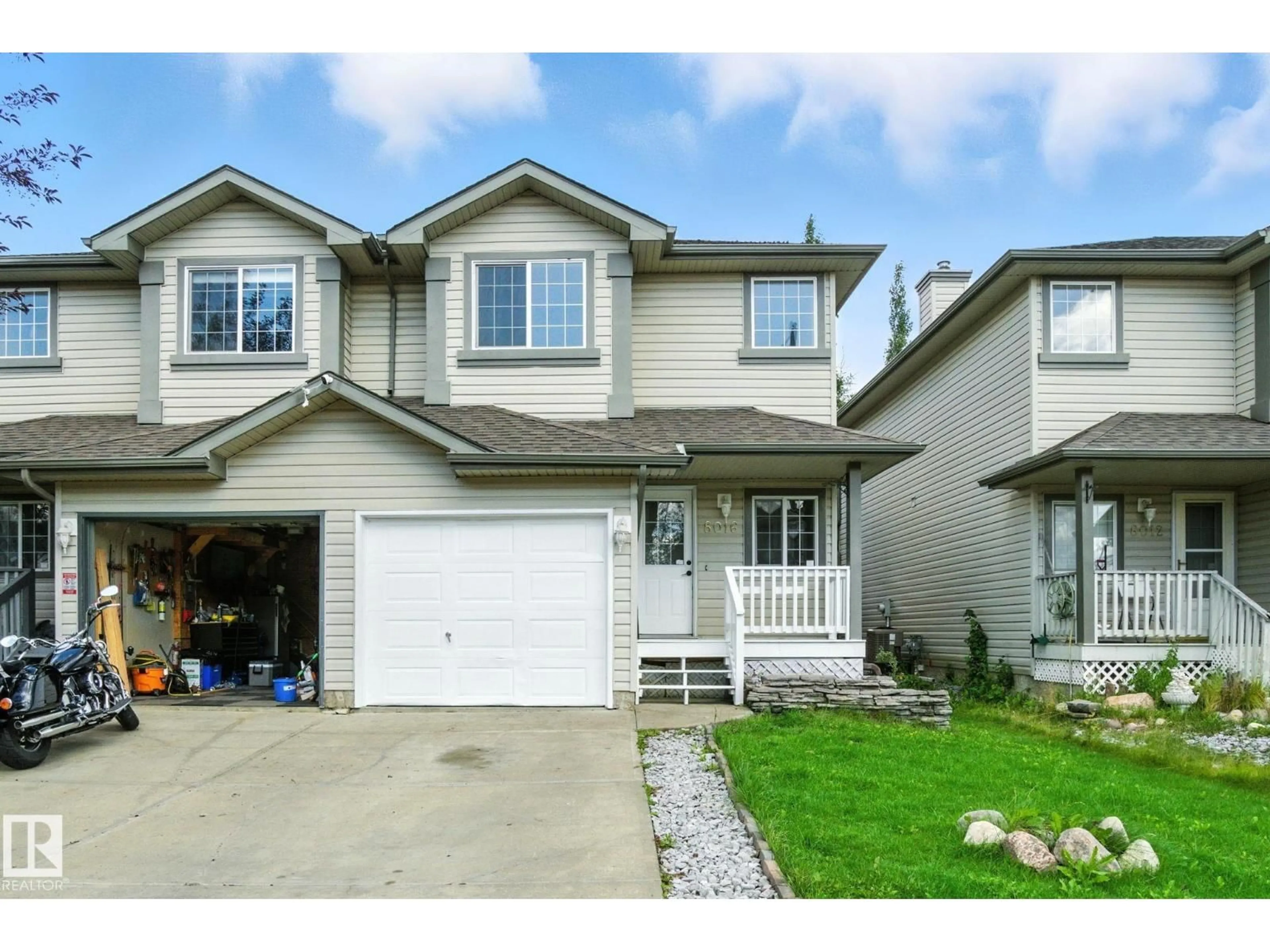 Home with vinyl exterior material, street for SW - 8016 2 AV, Edmonton Alberta T6X1K3