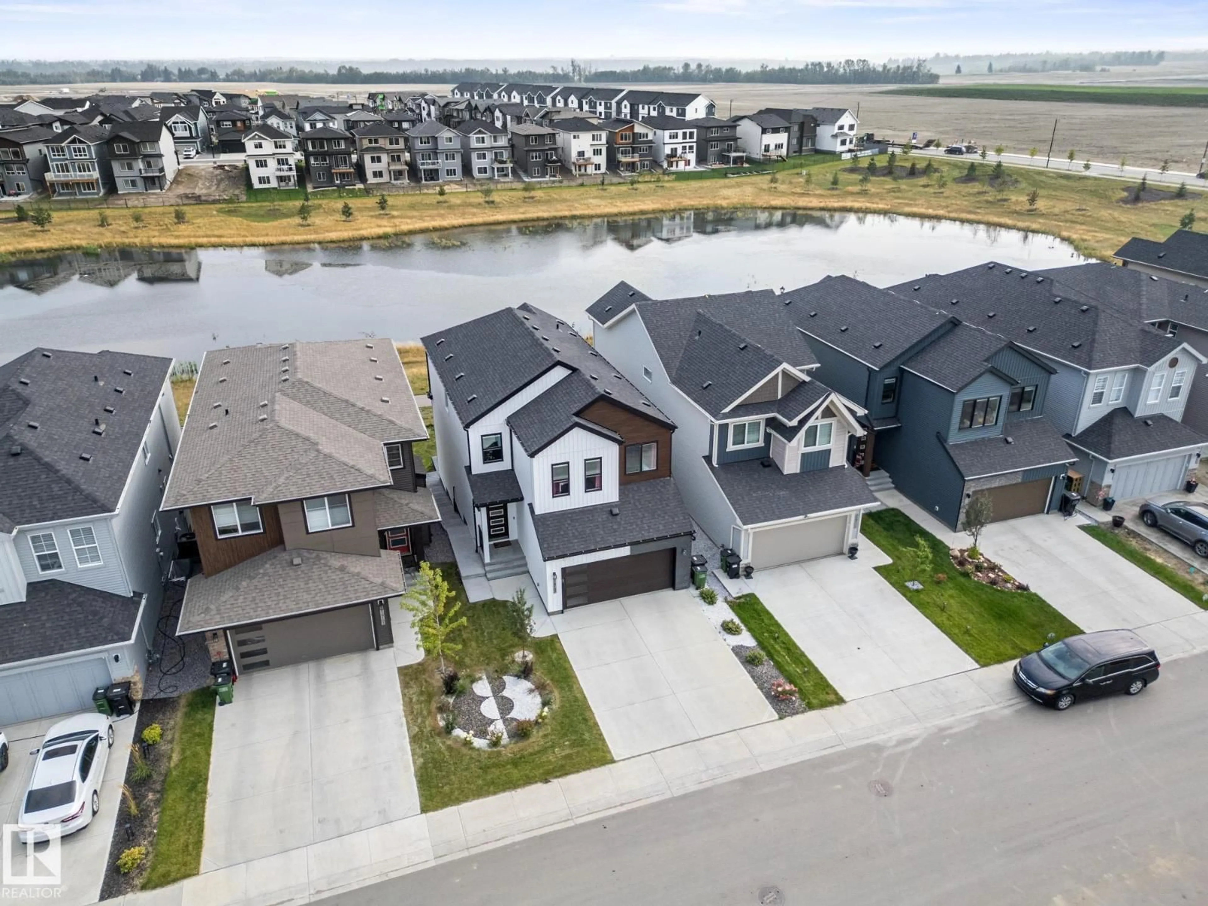 A pic from outside/outdoor area/front of a property/back of a property/a pic from drone, water/lake/river/ocean view for NW - 19107 22 AV, Edmonton Alberta T6M1R1