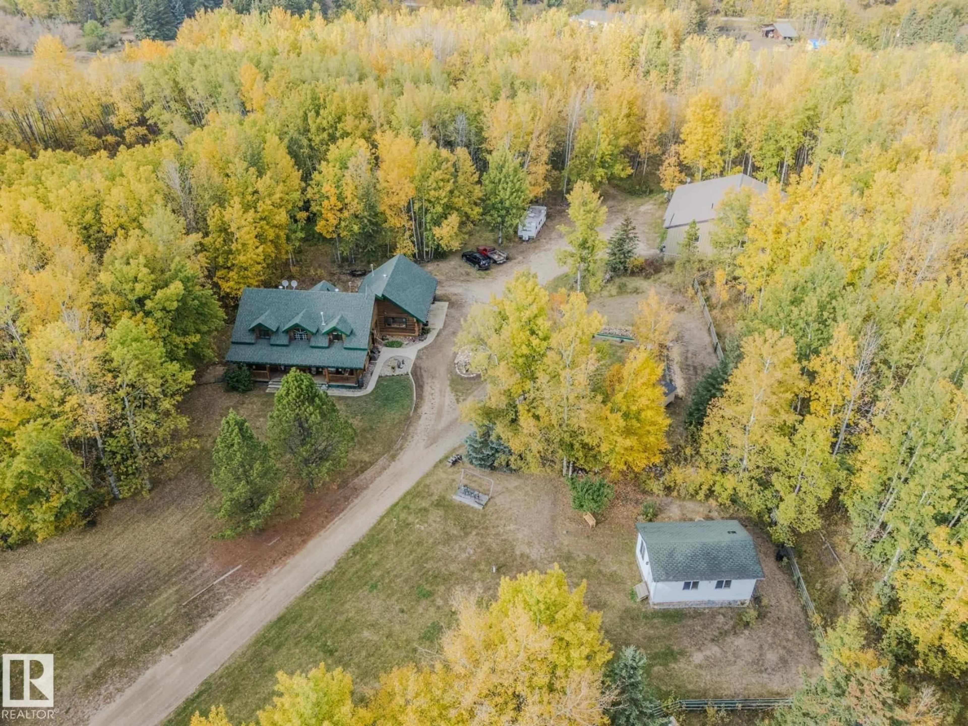 A pic from outside/outdoor area/front of a property/back of a property/a pic from drone, forest/trees view for 1524 PARKLAND DR, Rural Parkland County Alberta T7Y2T6