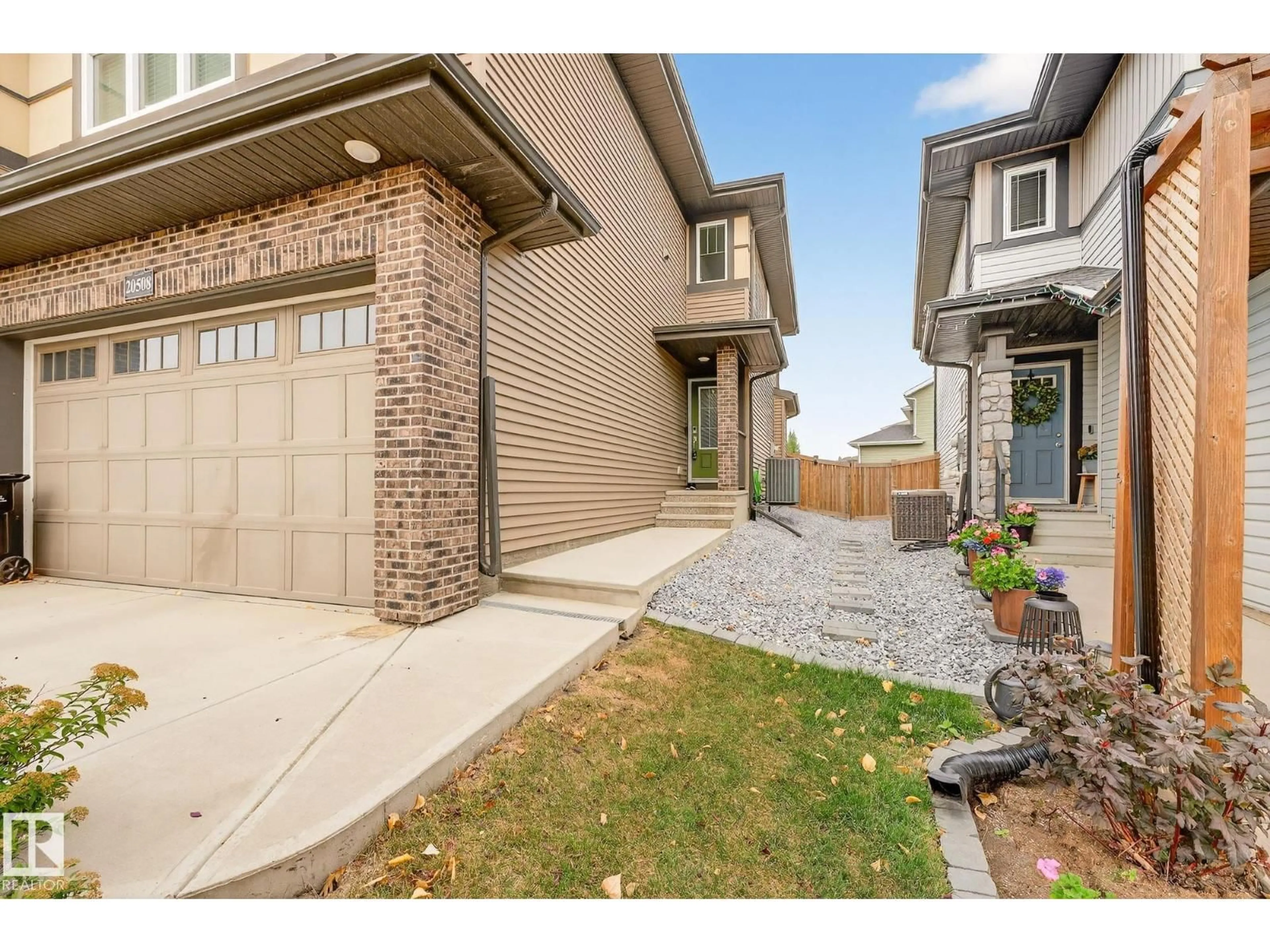 Home with brick exterior material, street for 20508 128 AV, Edmonton Alberta T5S0L8