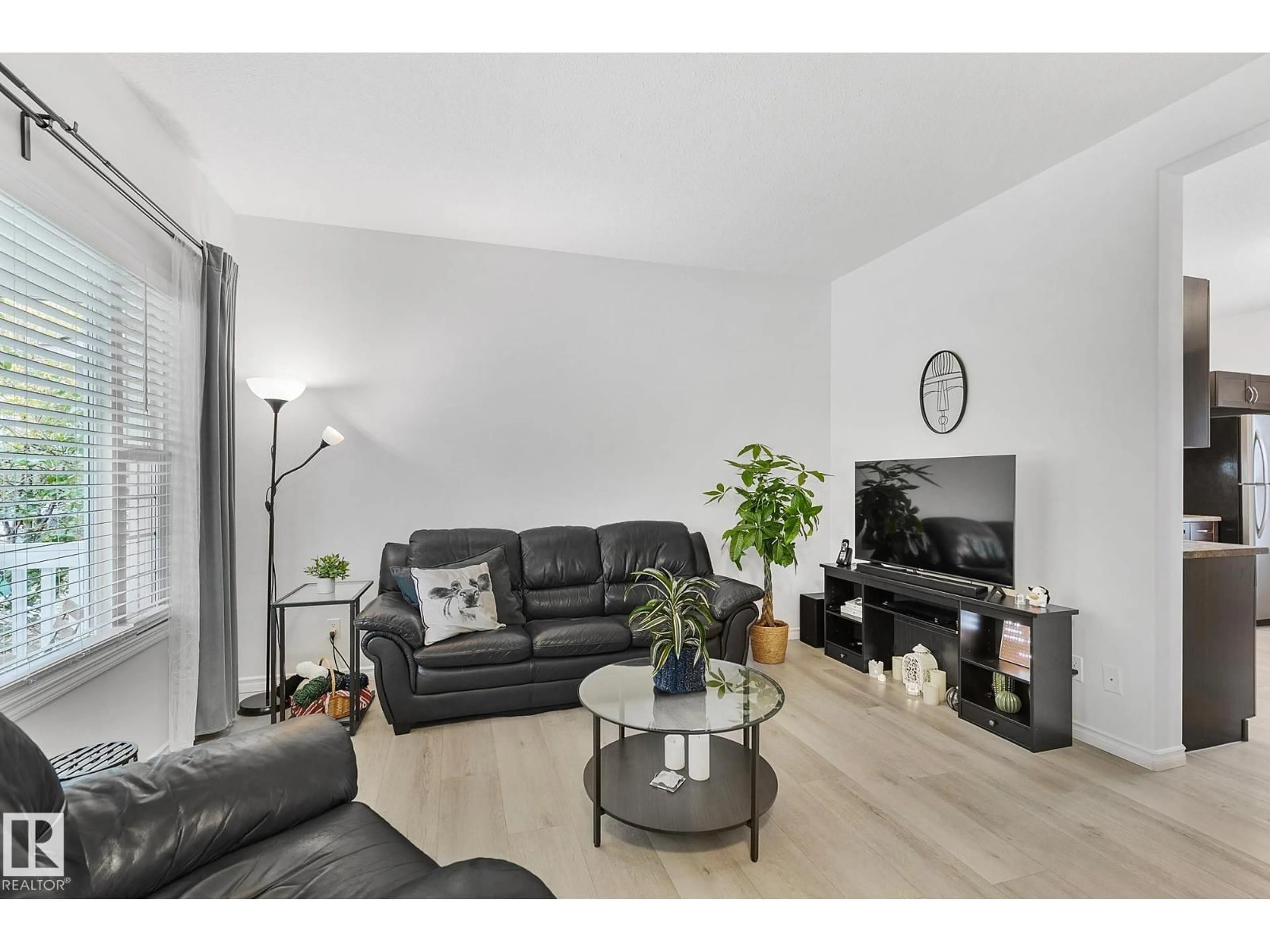Living room with furniture, wood/laminate floor for 4206 ORCHARDS DR, Edmonton Alberta T6X1N9