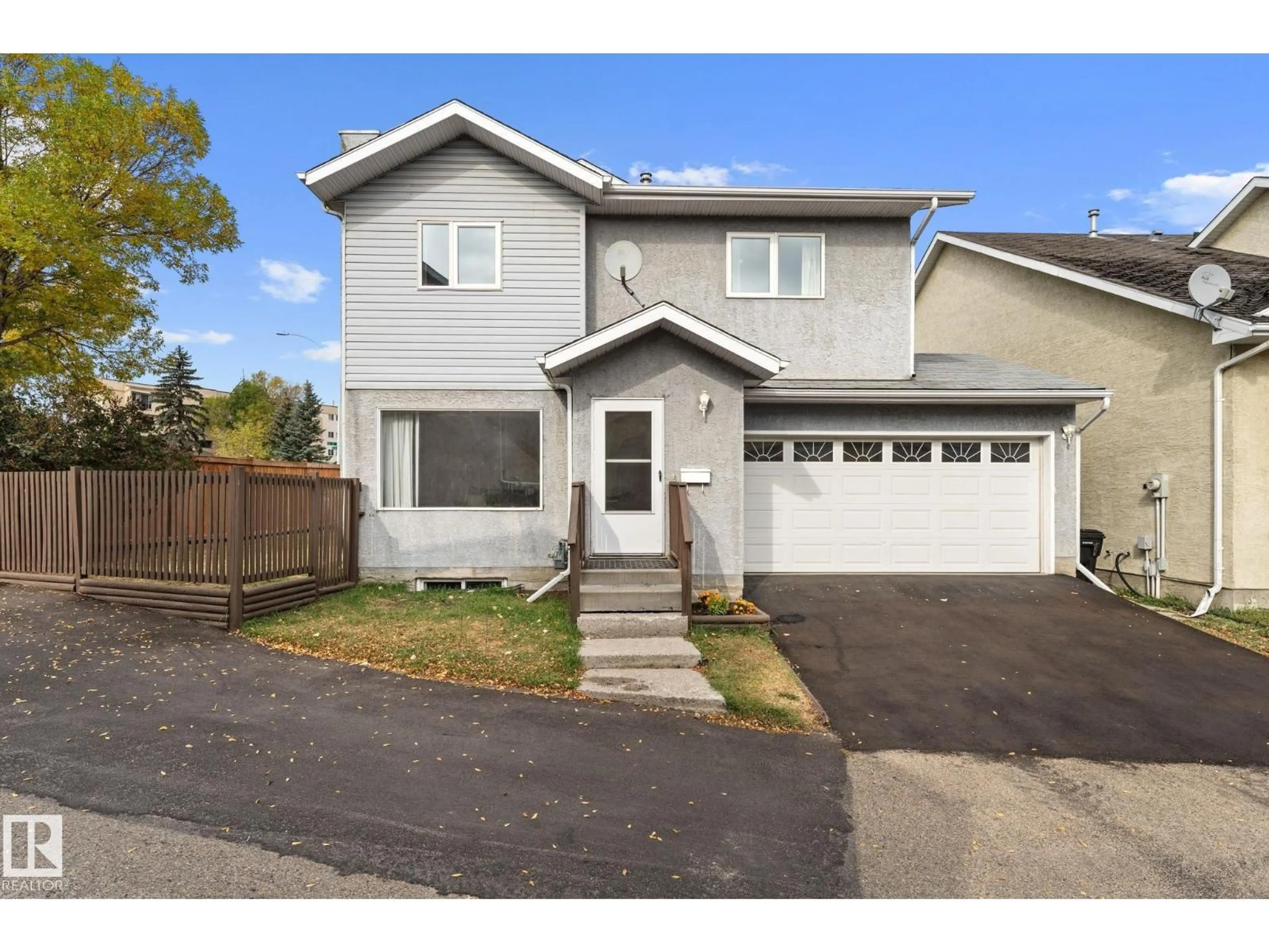 Home with vinyl exterior material, street for NW - 14659 52 ST, Edmonton Alberta T5A4Z7
