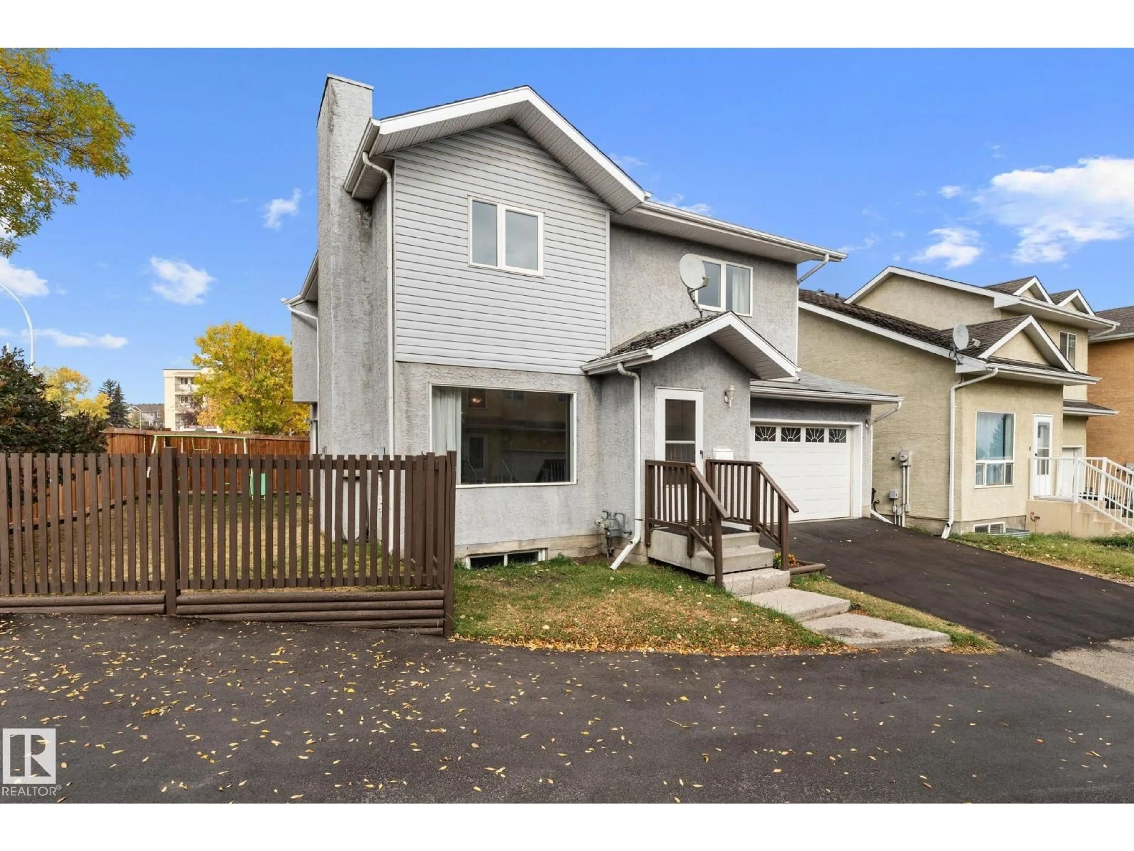 Home with vinyl exterior material, street for NW - 14659 52 ST, Edmonton Alberta T5A4Z7