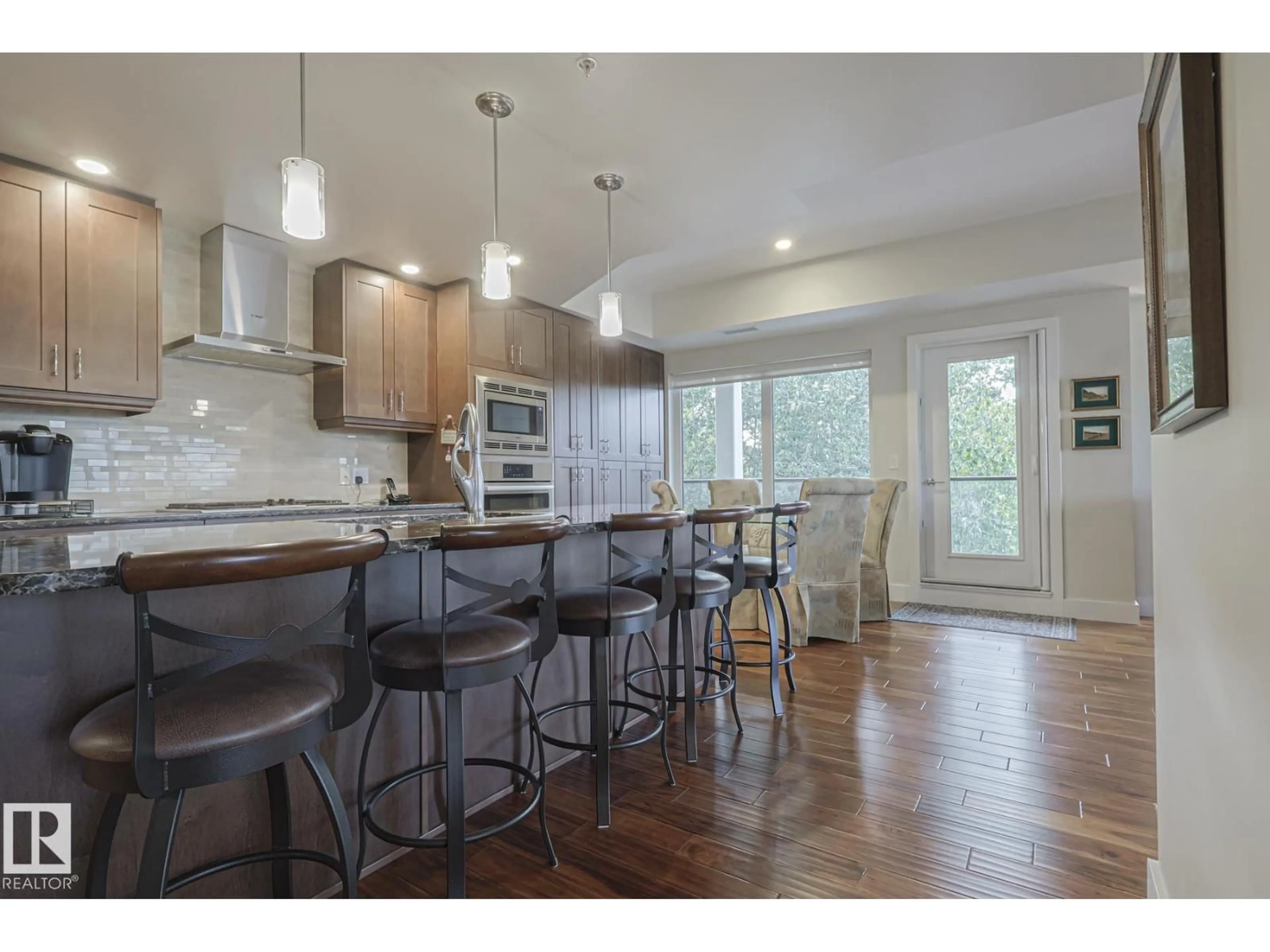 Open concept kitchen, wood/laminate floor for 301 - 200 BELLEROSE DR, St. Albert Alberta T8N7P7