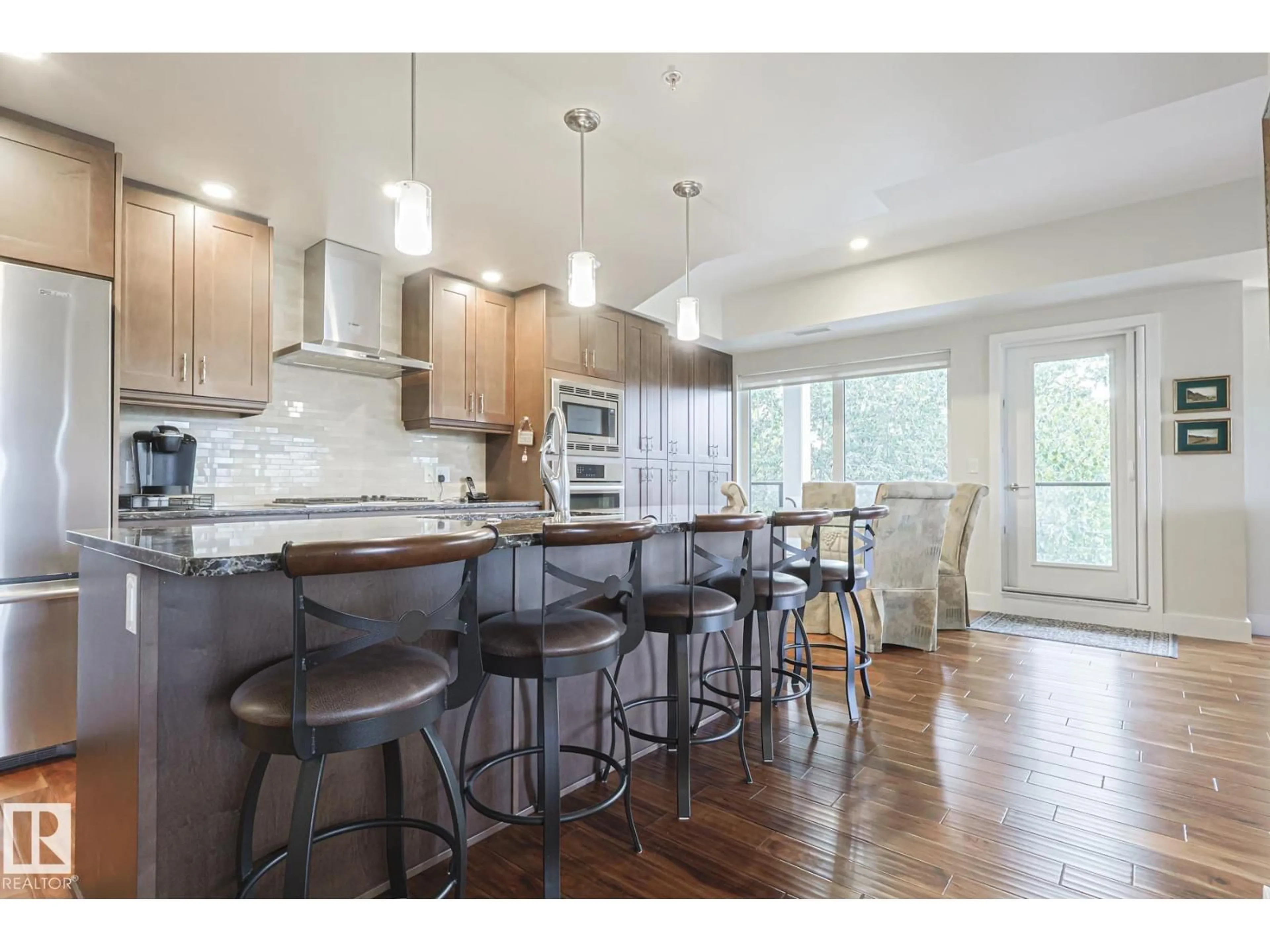 Open concept kitchen, wood/laminate floor for 301 - 200 BELLEROSE DR, St. Albert Alberta T8N7P7