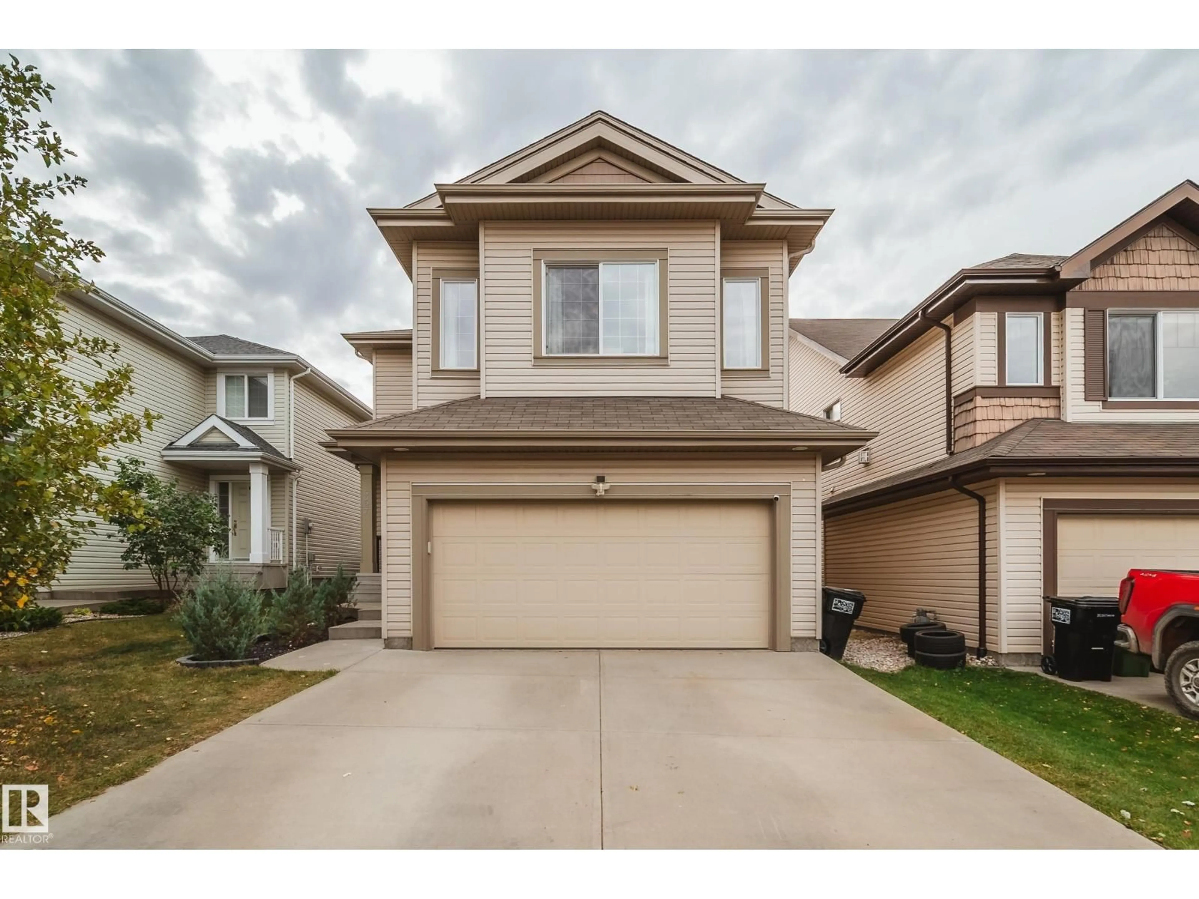 Home with vinyl exterior material, street for 5927 6 AV, Edmonton Alberta T6X0G4