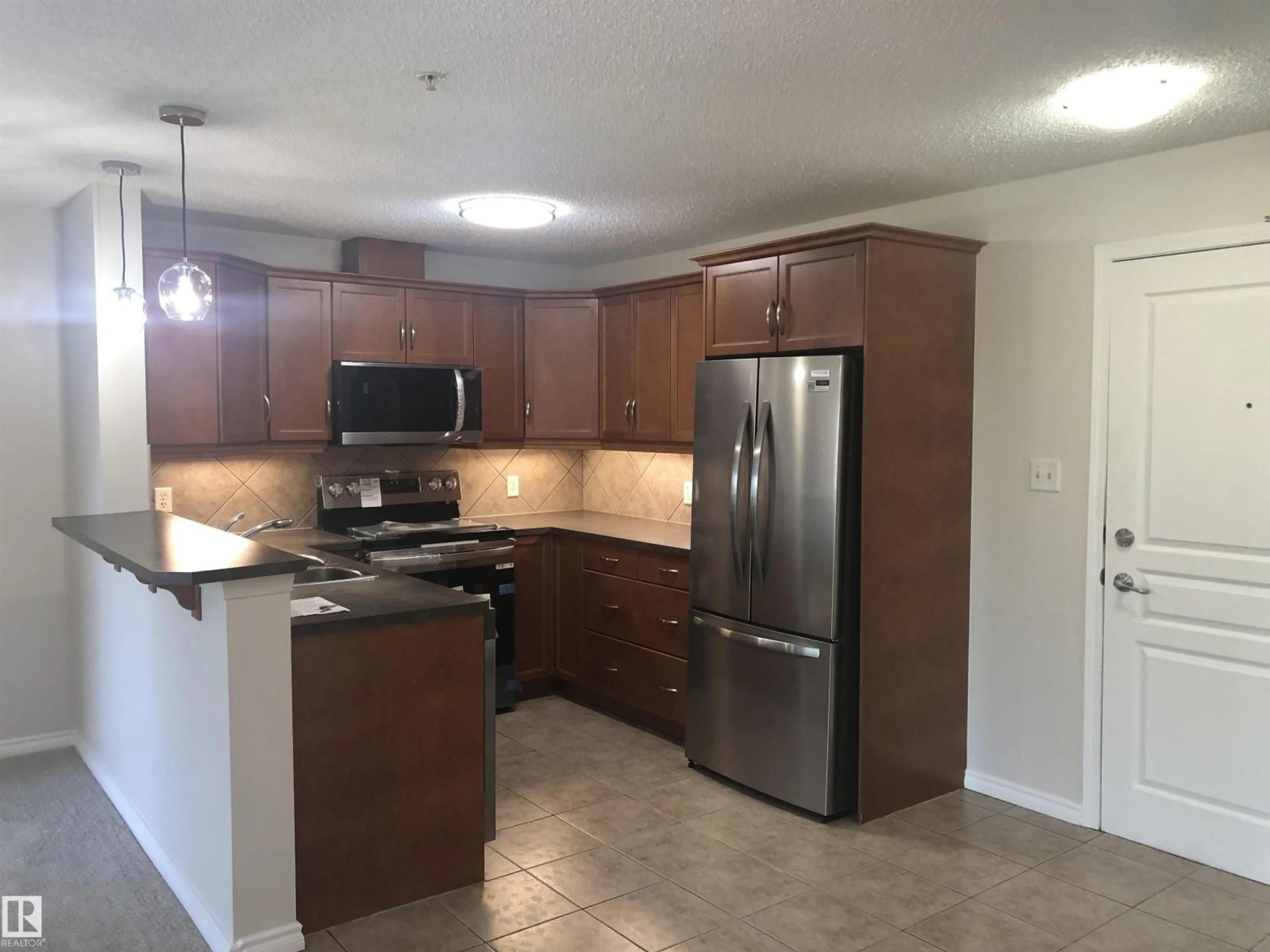 Standard kitchen, unknown for 2436 - 343 GUARDIAN RD, Edmonton Alberta T5T2P5