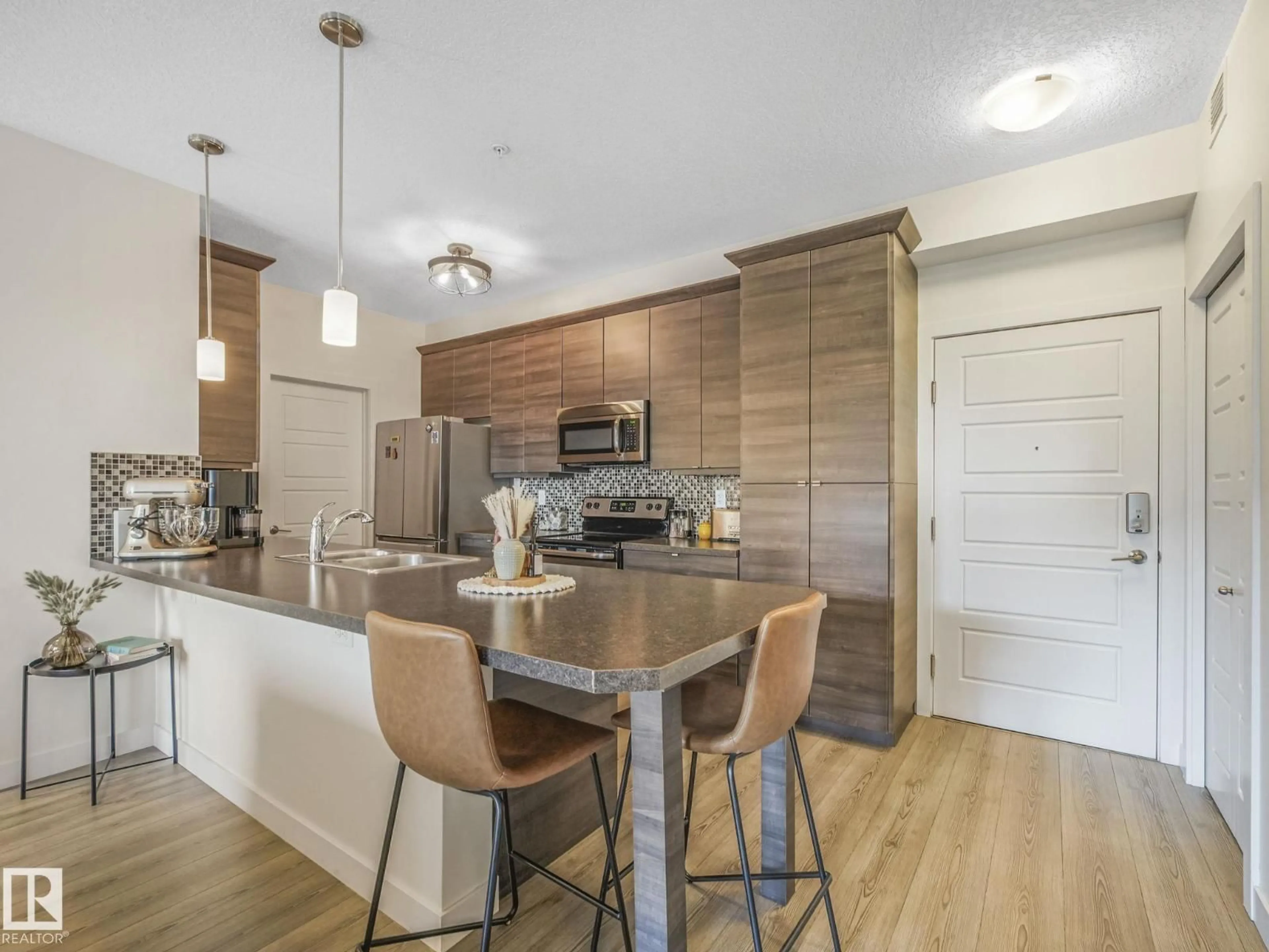 Open concept kitchen, wood/laminate floor for 2588 - 316 ANDERSON WY, Edmonton Alberta T6W0R2