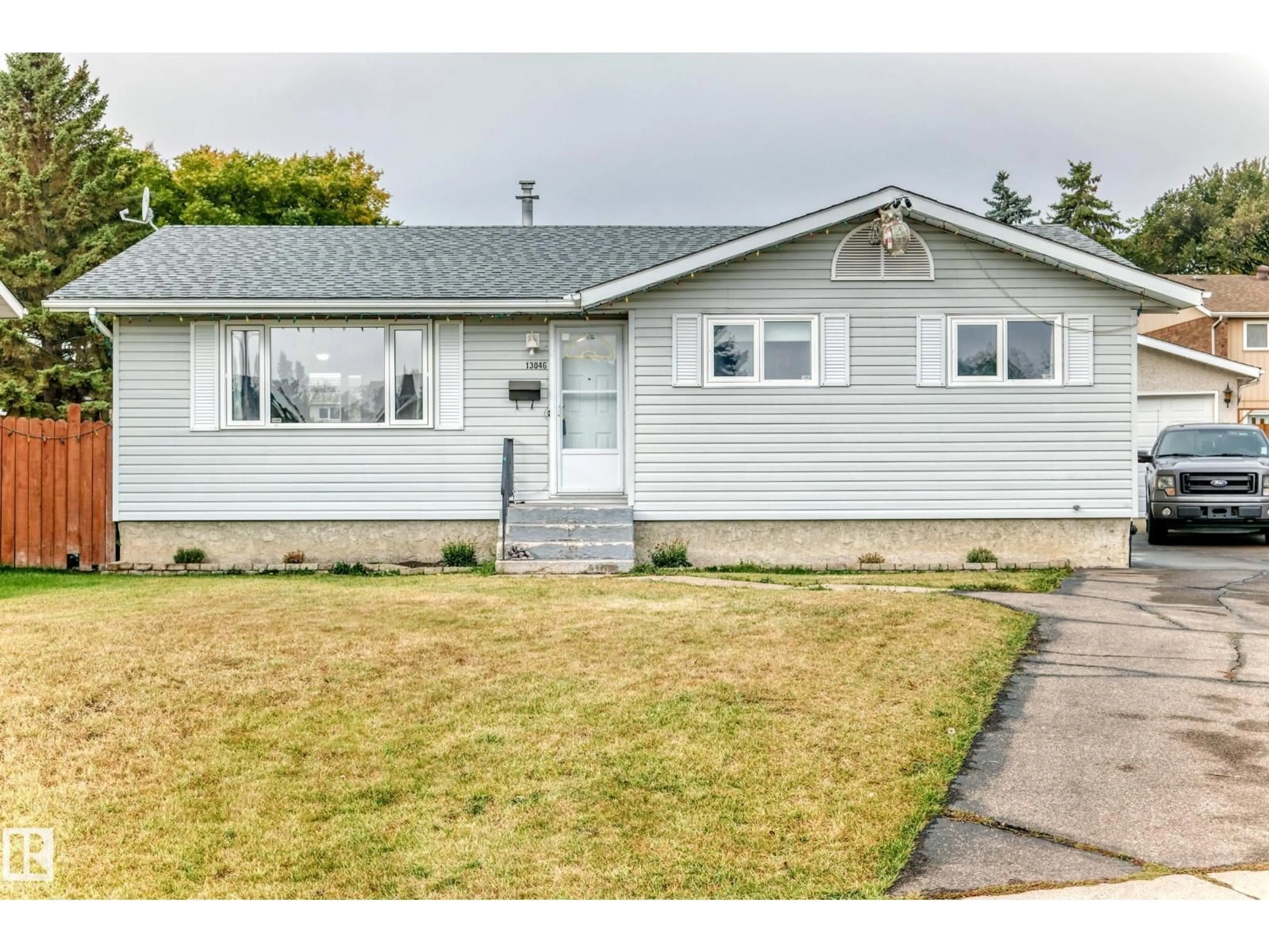 Home with vinyl exterior material, street for NW - 13046 32A ST, Edmonton Alberta T5A3E5