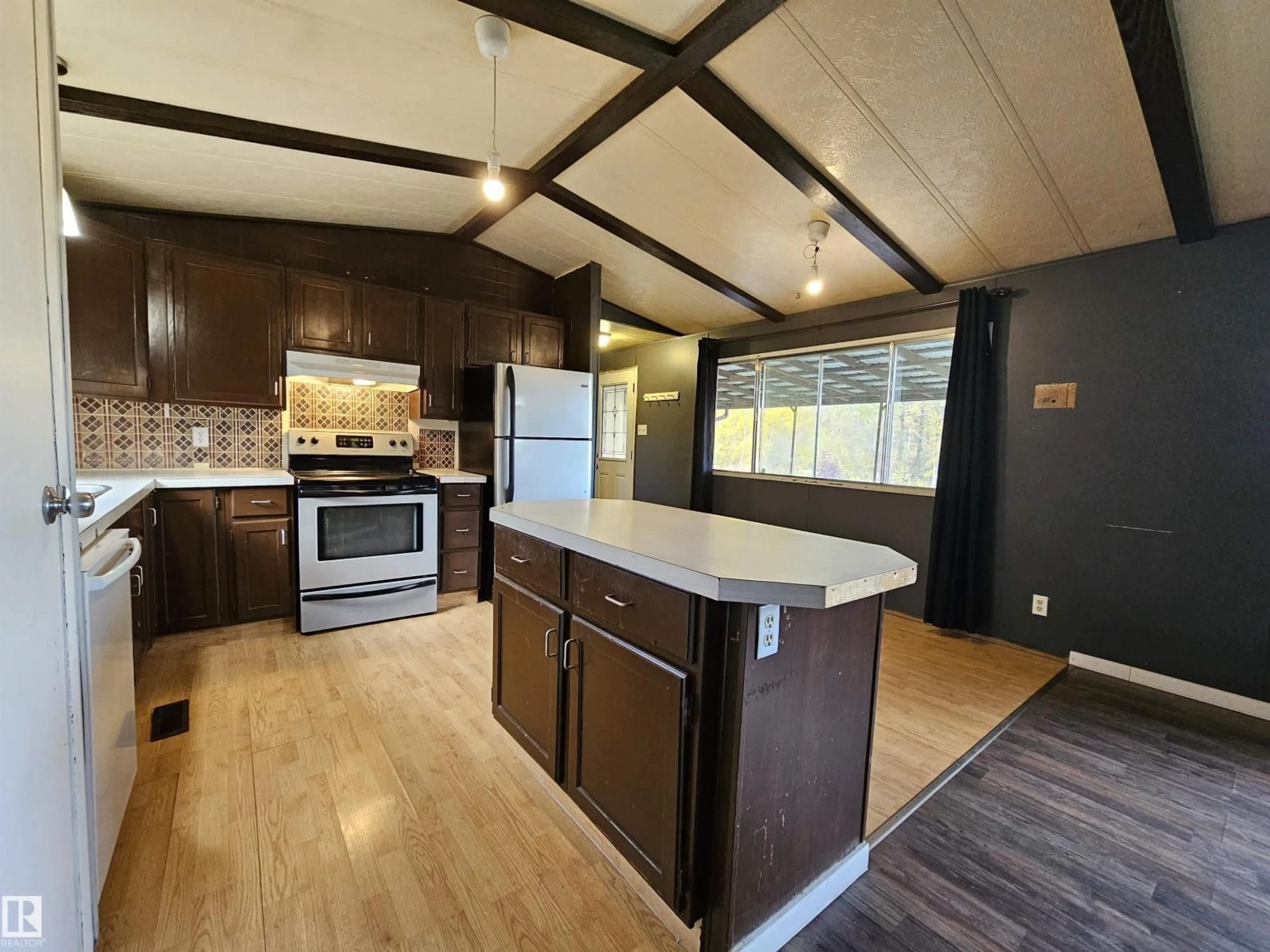 Open concept kitchen, wood/laminate floor for 49510 RGE ROAD 80, Rural Brazeau County Alberta T7A2A3