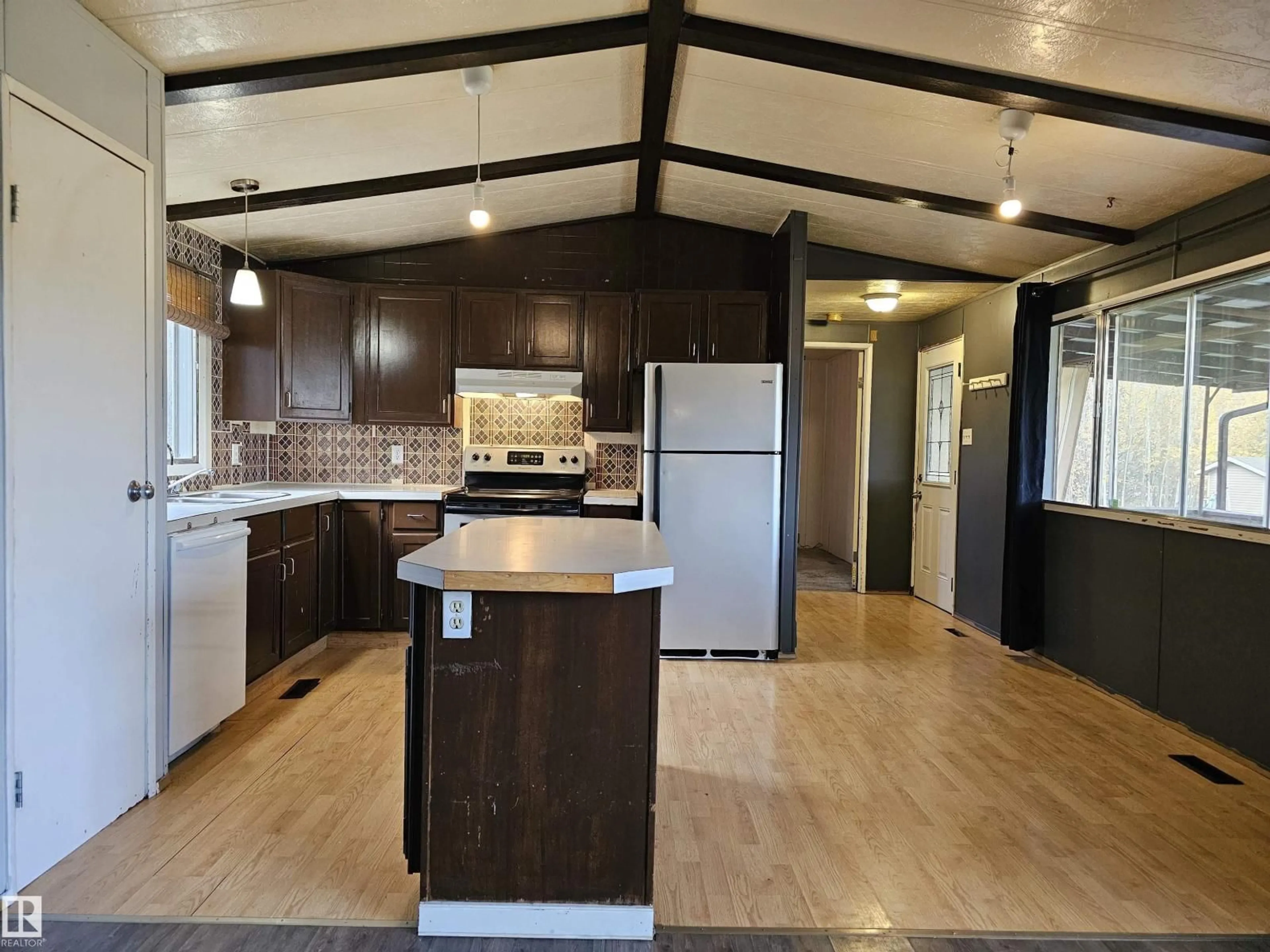 Open concept kitchen, wood/laminate floor for 49510 RGE ROAD 80, Rural Brazeau County Alberta T7A2A3