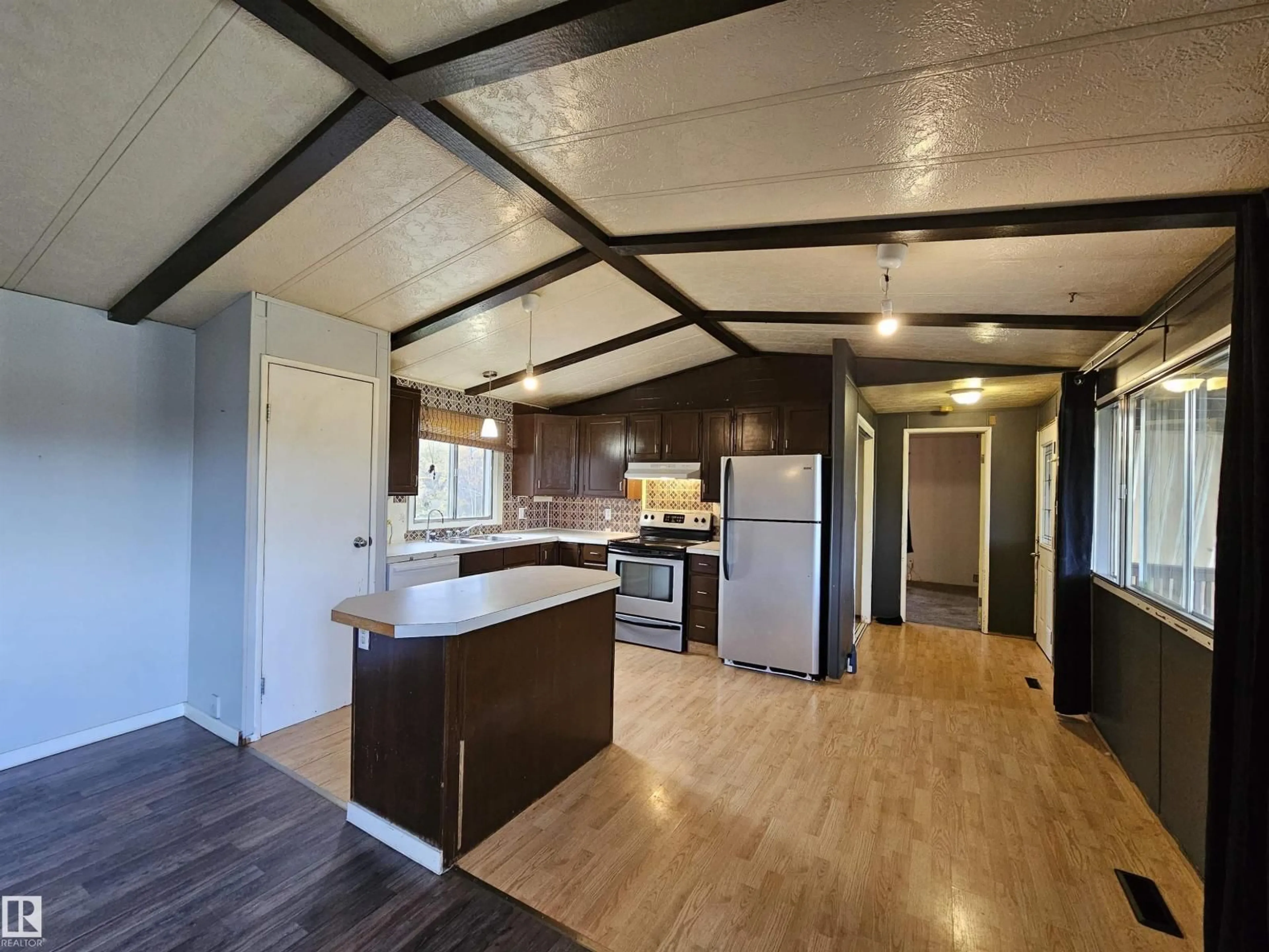 Open concept kitchen, wood/laminate floor for 49510 RGE ROAD 80, Rural Brazeau County Alberta T7A2A3