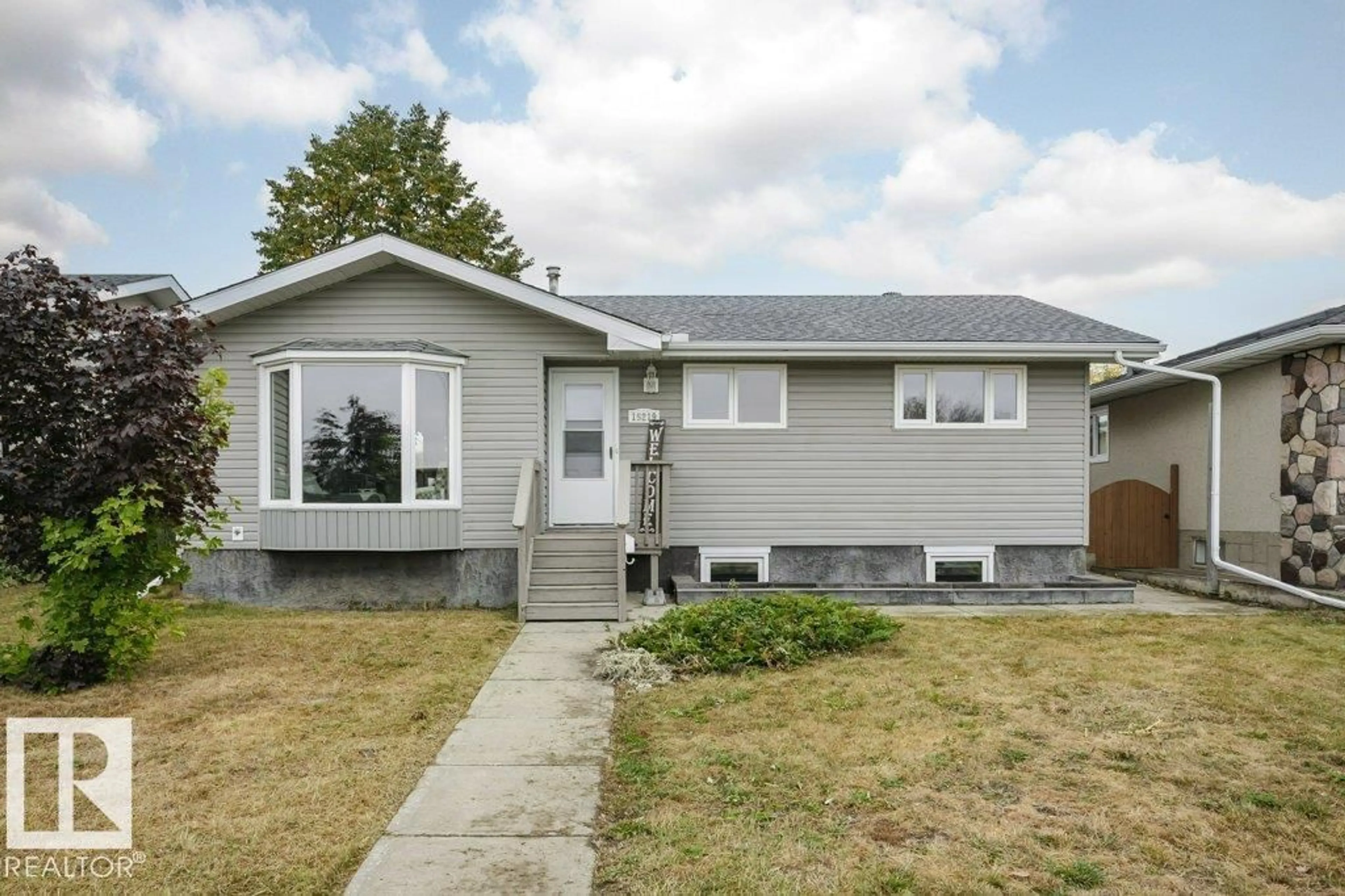 Home with vinyl exterior material, street for 15219 93 ST, Edmonton Alberta T5E3V1
