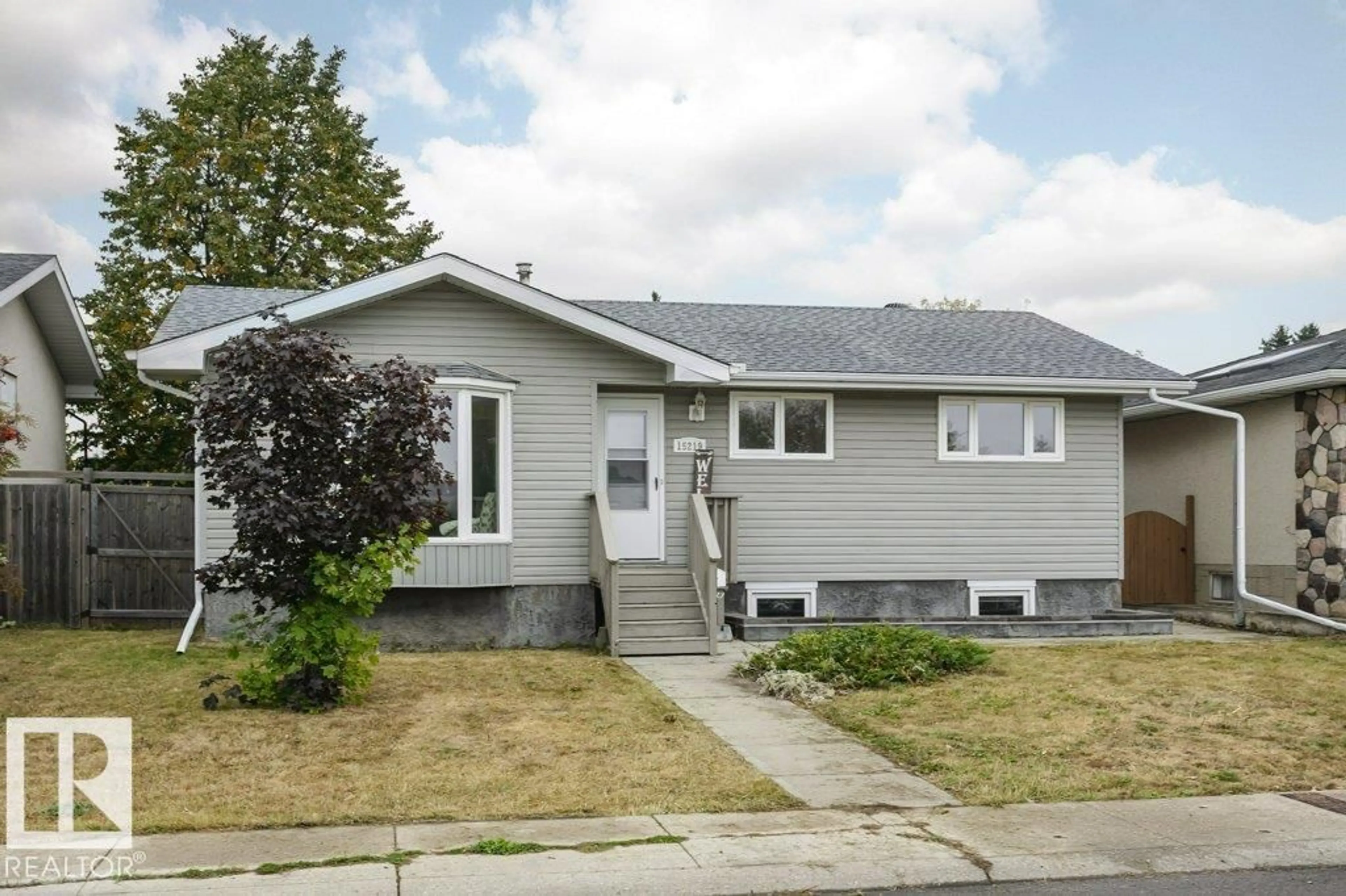 Home with vinyl exterior material, street for 15219 93 ST, Edmonton Alberta T5E3V1