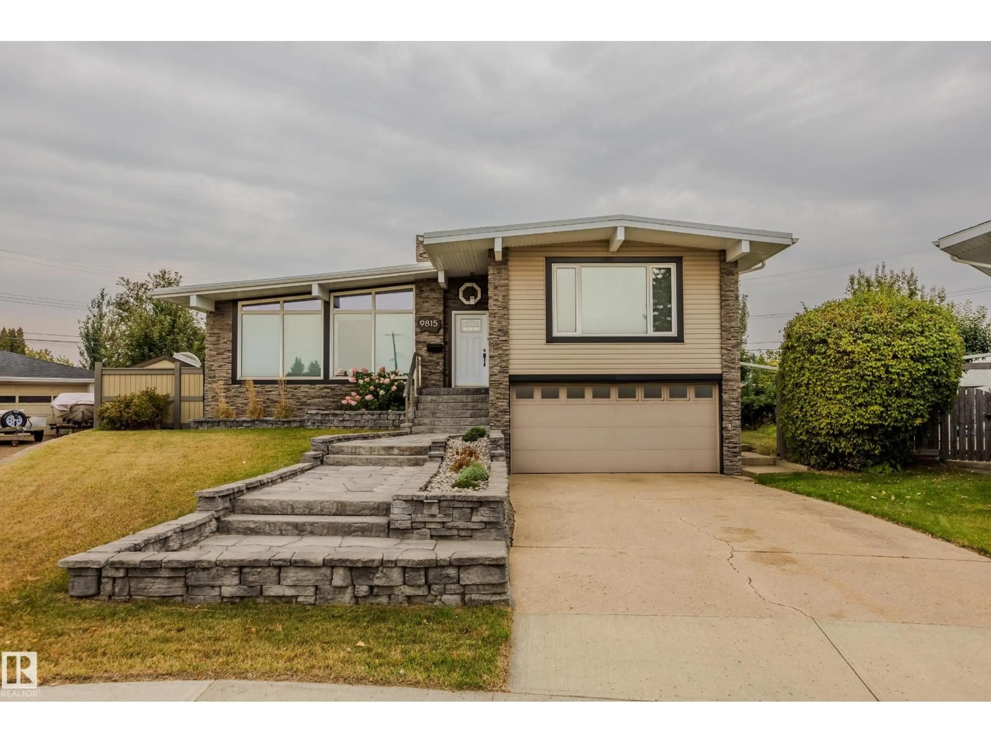 Home with vinyl exterior material, street for 9815 68 ST, Edmonton Alberta T6A2S4