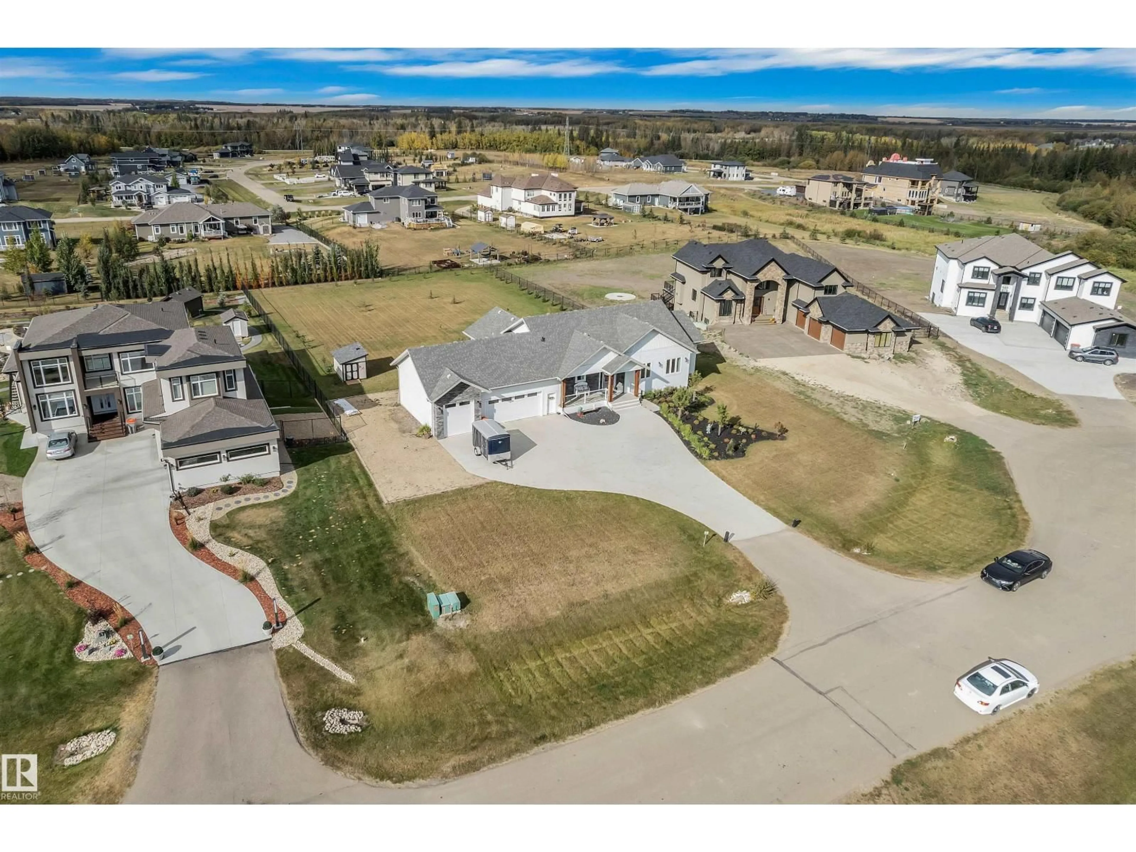 A pic from outside/outdoor area/front of a property/back of a property/a pic from drone, unknown for 59 26409 TWP ROAD 532 A, Rural Parkland County Alberta T7X0G3