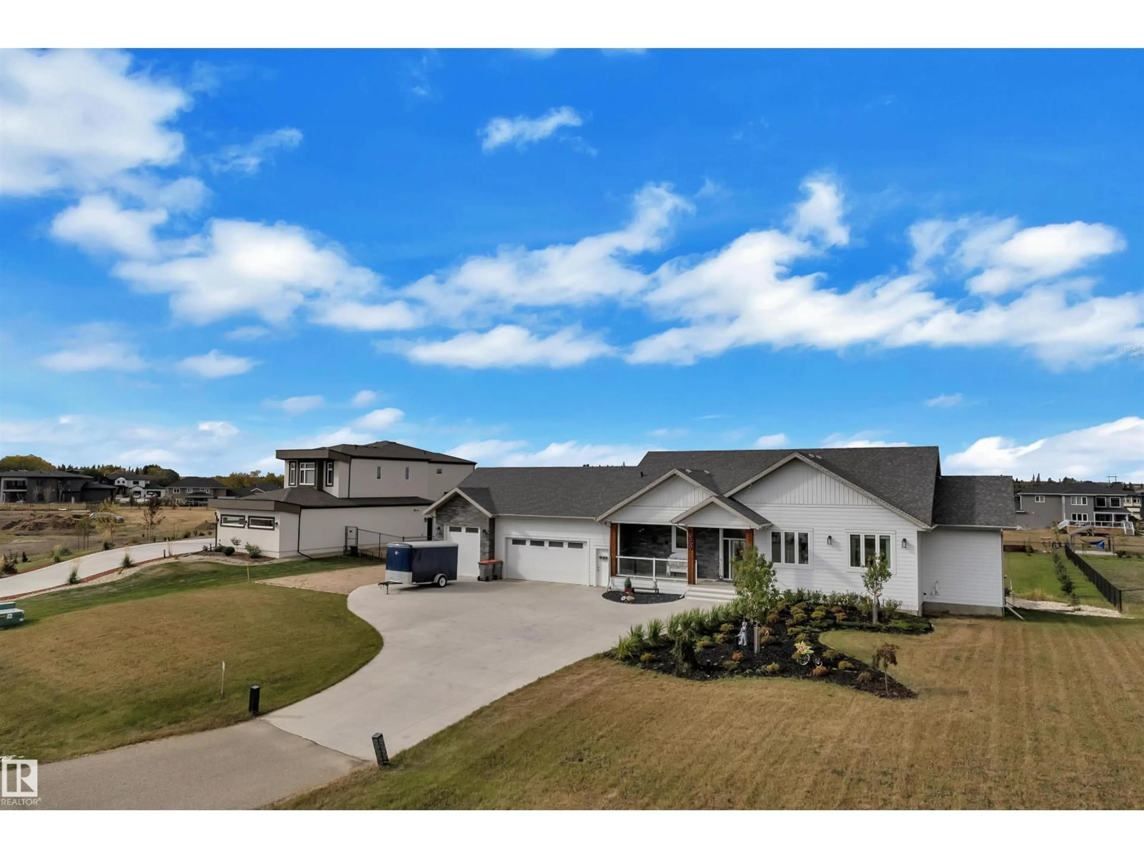 A pic from outside/outdoor area/front of a property/back of a property/a pic from drone, unknown for 59 26409 TWP ROAD 532 A, Rural Parkland County Alberta T7X0G3