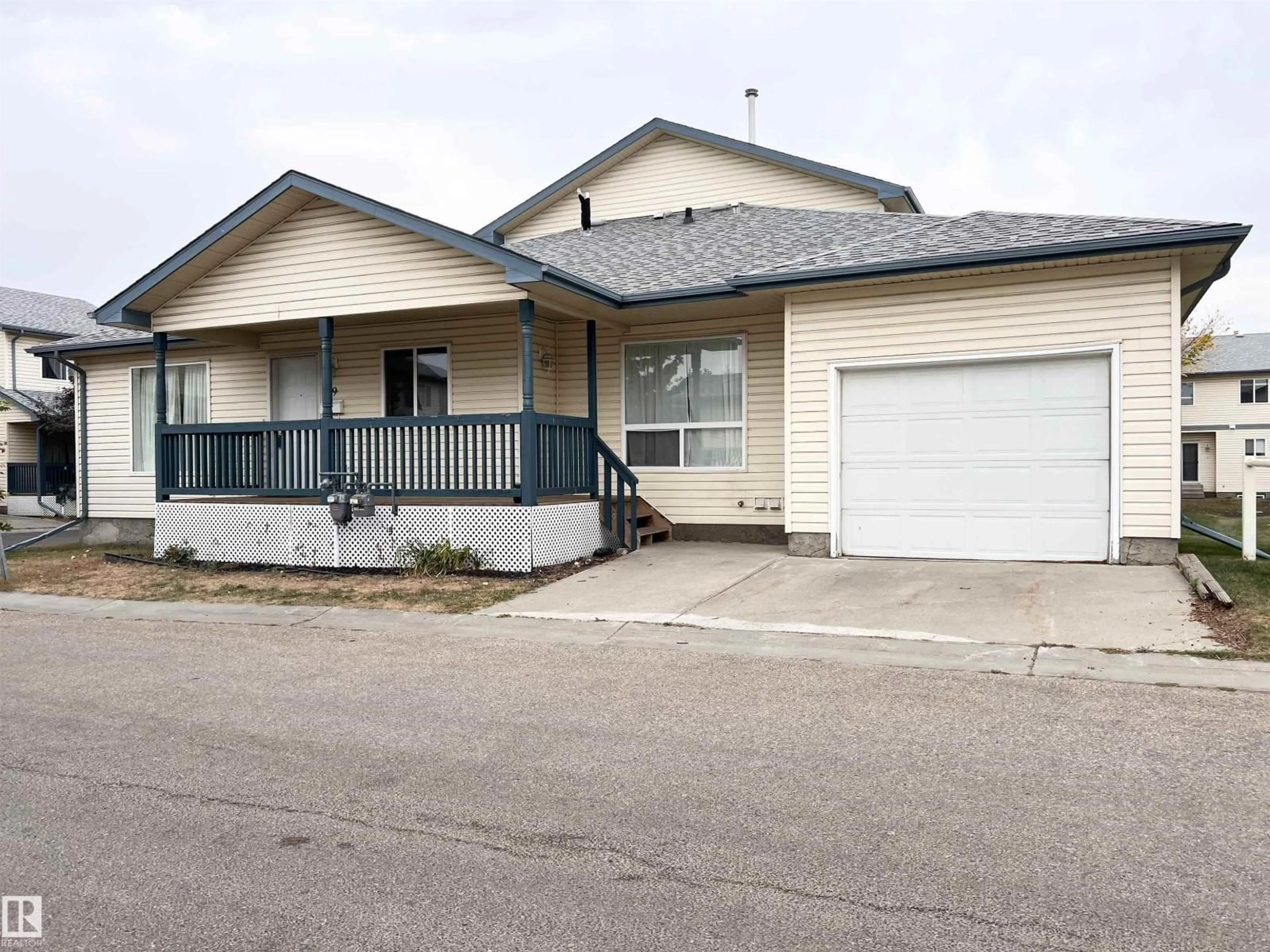 Home with vinyl exterior material, street for 10909 - 19 106 ST NW, Edmonton Alberta T5H4M7