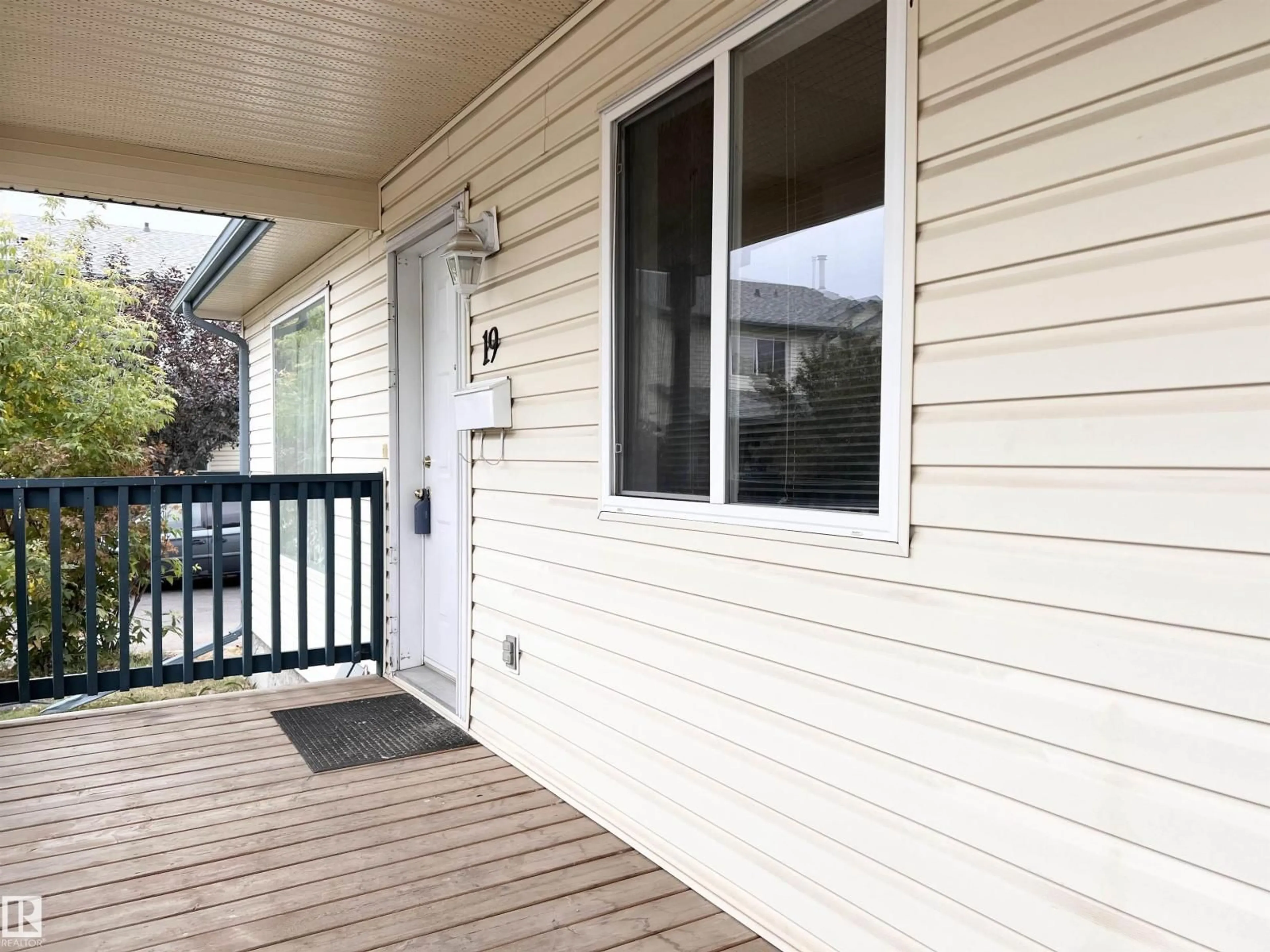 Home with vinyl exterior material, street for 10909 - 19 106 ST NW, Edmonton Alberta T5H4M7