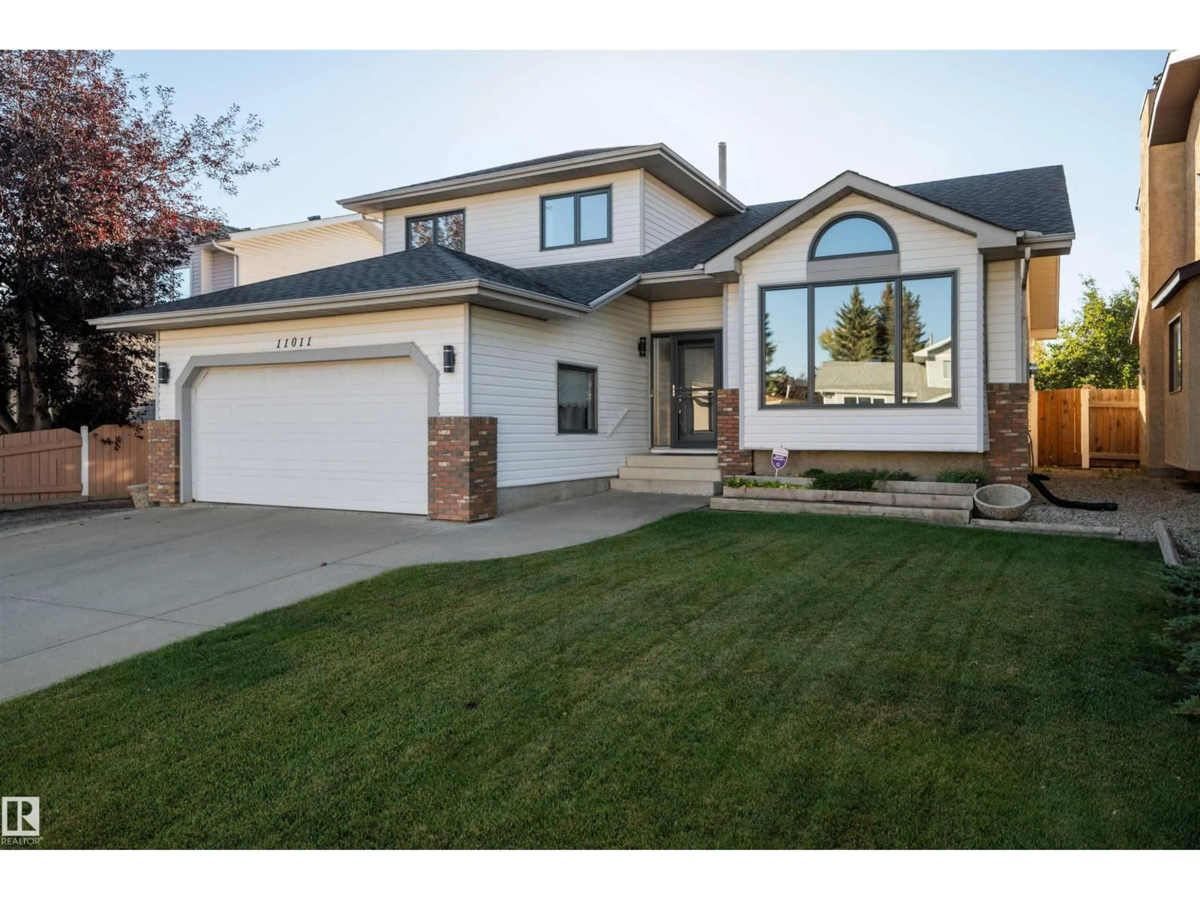 Home with vinyl exterior material, street for NW - 11011 11 AV, Edmonton Alberta T6J6M9