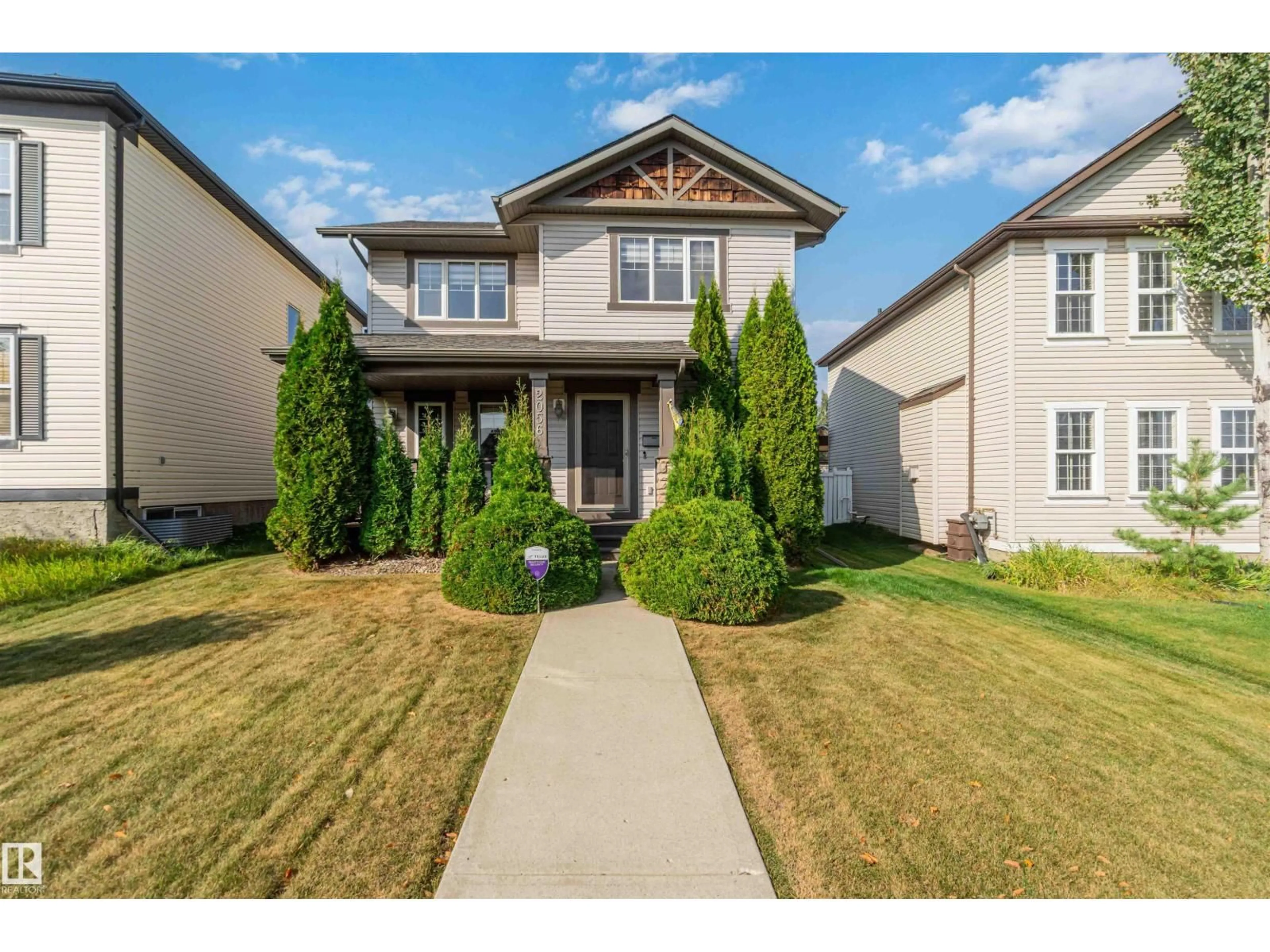 Home with vinyl exterior material, street for 2056 TOWNE CENTRE BV, Edmonton Alberta T6R3M7