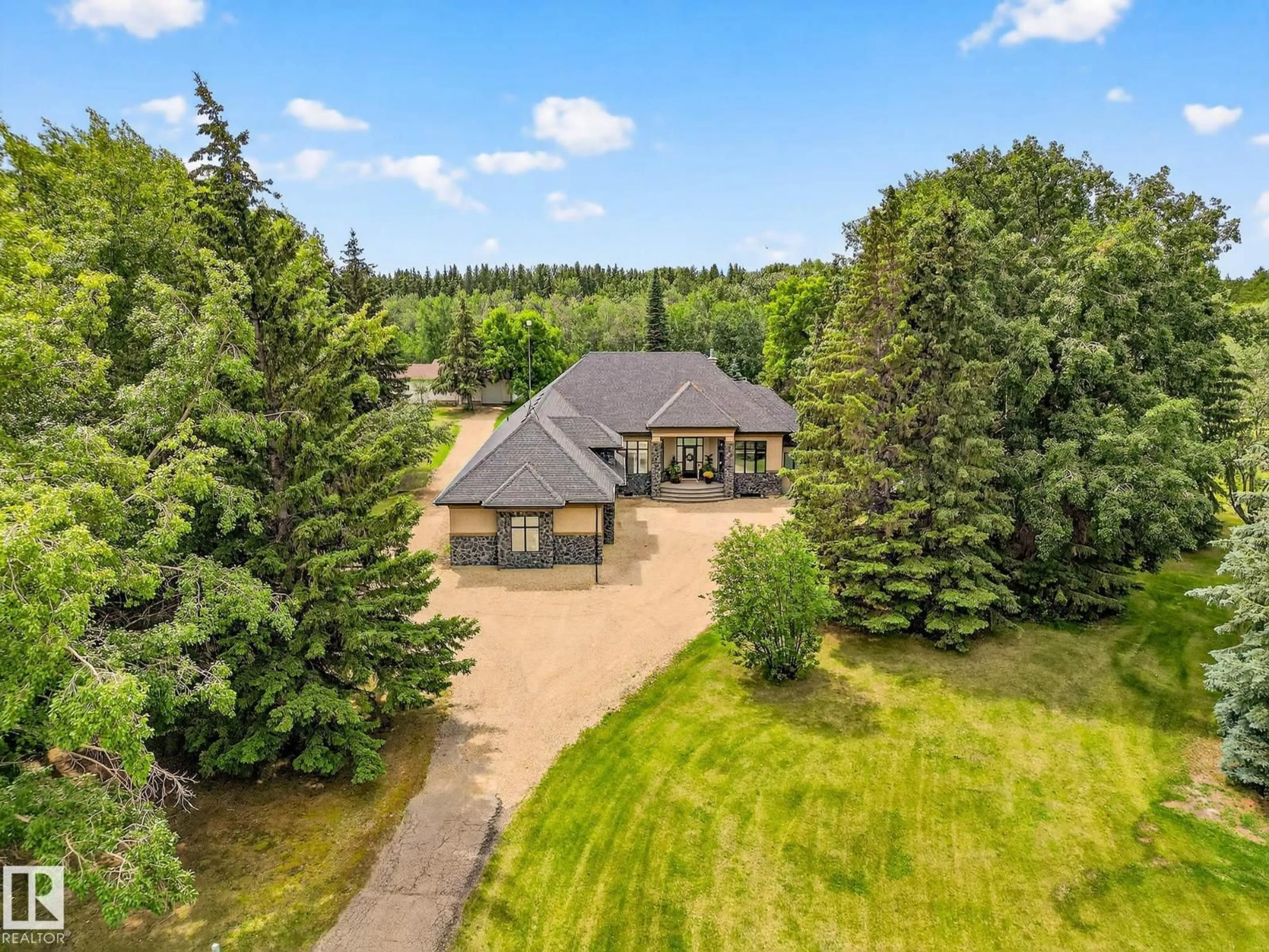 A pic from outside/outdoor area/front of a property/back of a property/a pic from drone, unknown for 131 24203 TWP ROAD 554, Rural Sturgeon County Alberta T8T1X9