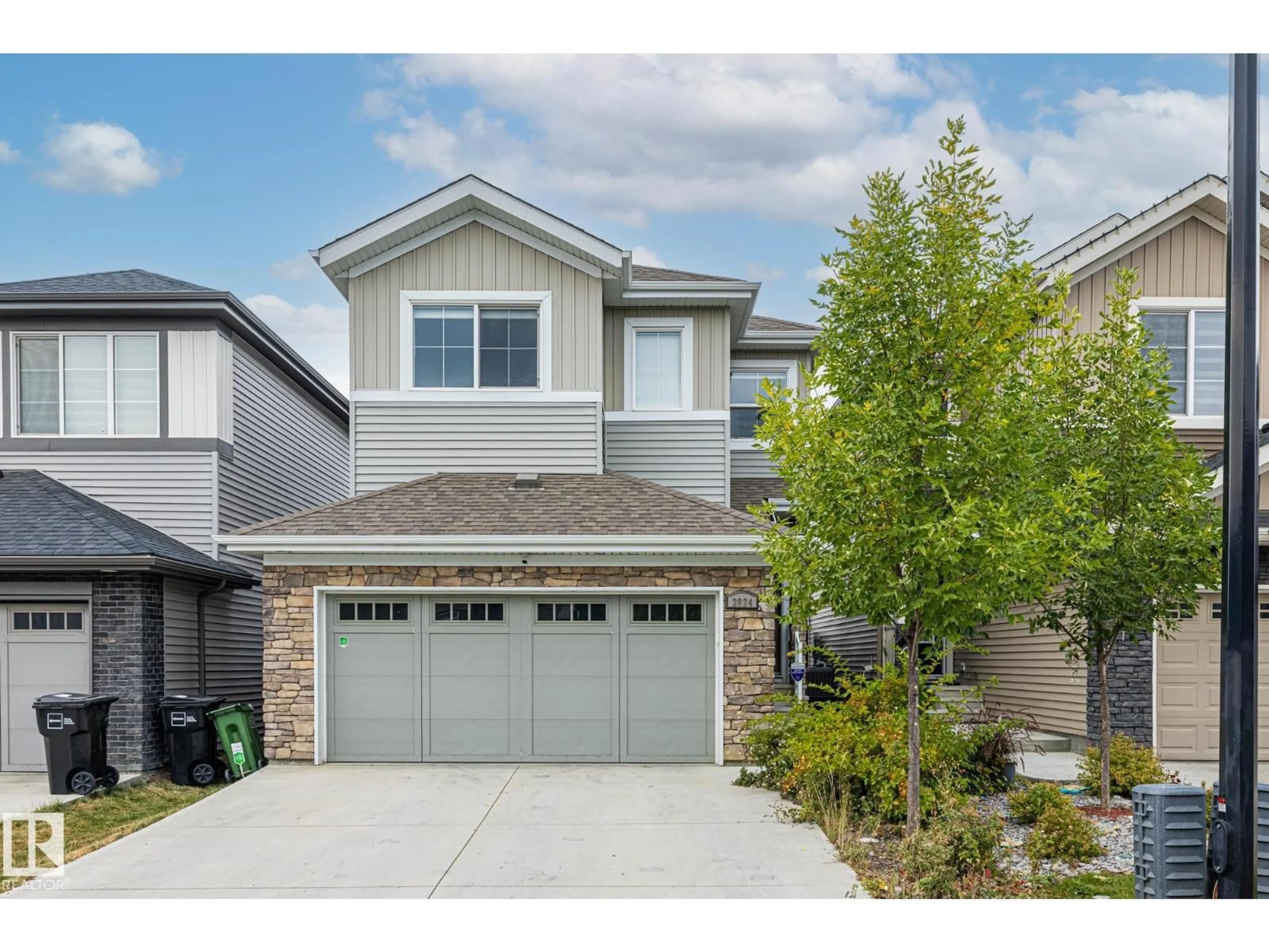 Home with vinyl exterior material, street for SW - 2024 160 ST, Edmonton Alberta T6W4E7