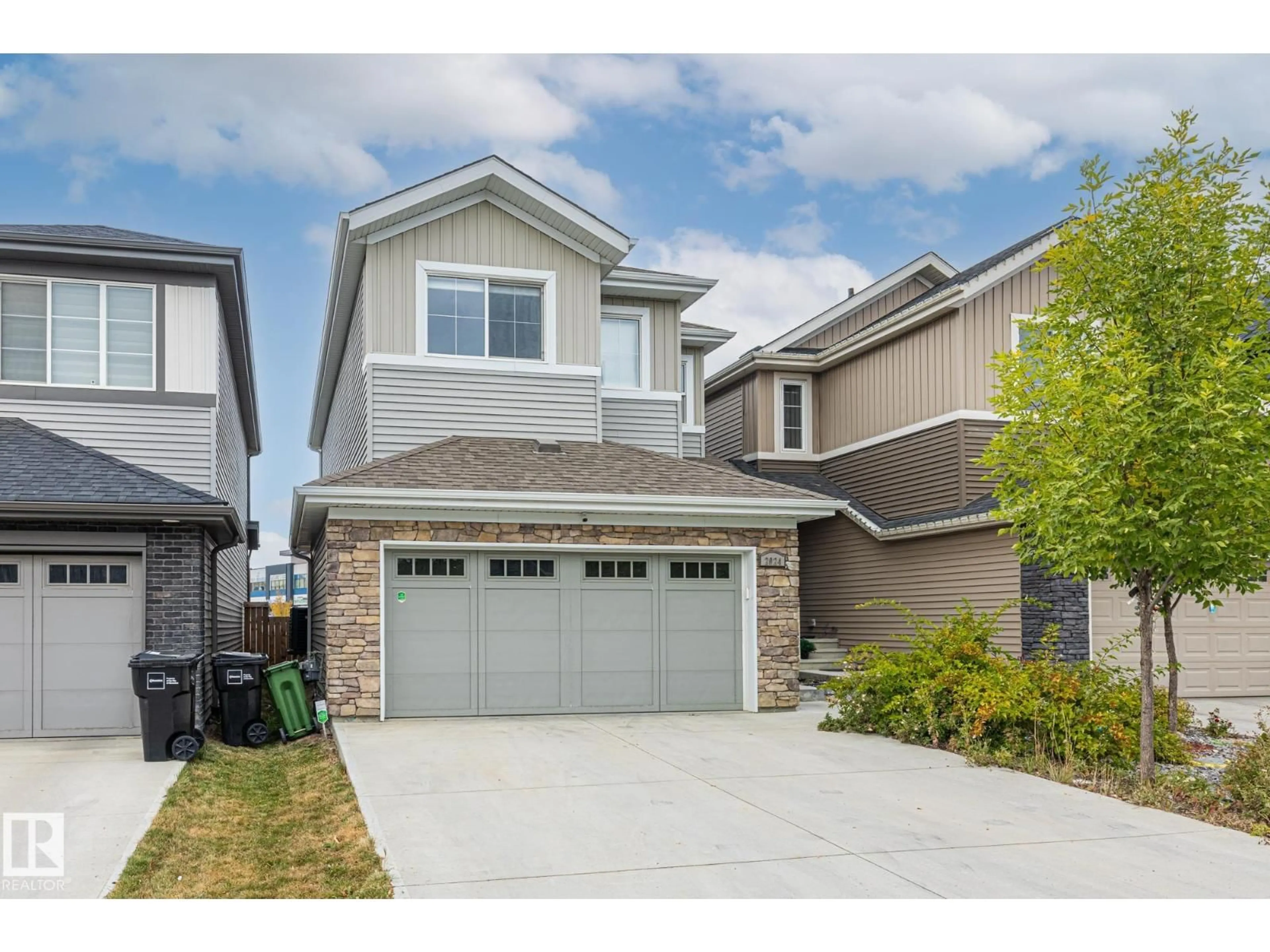 Home with vinyl exterior material, street for SW - 2024 160 ST, Edmonton Alberta T6W4E7