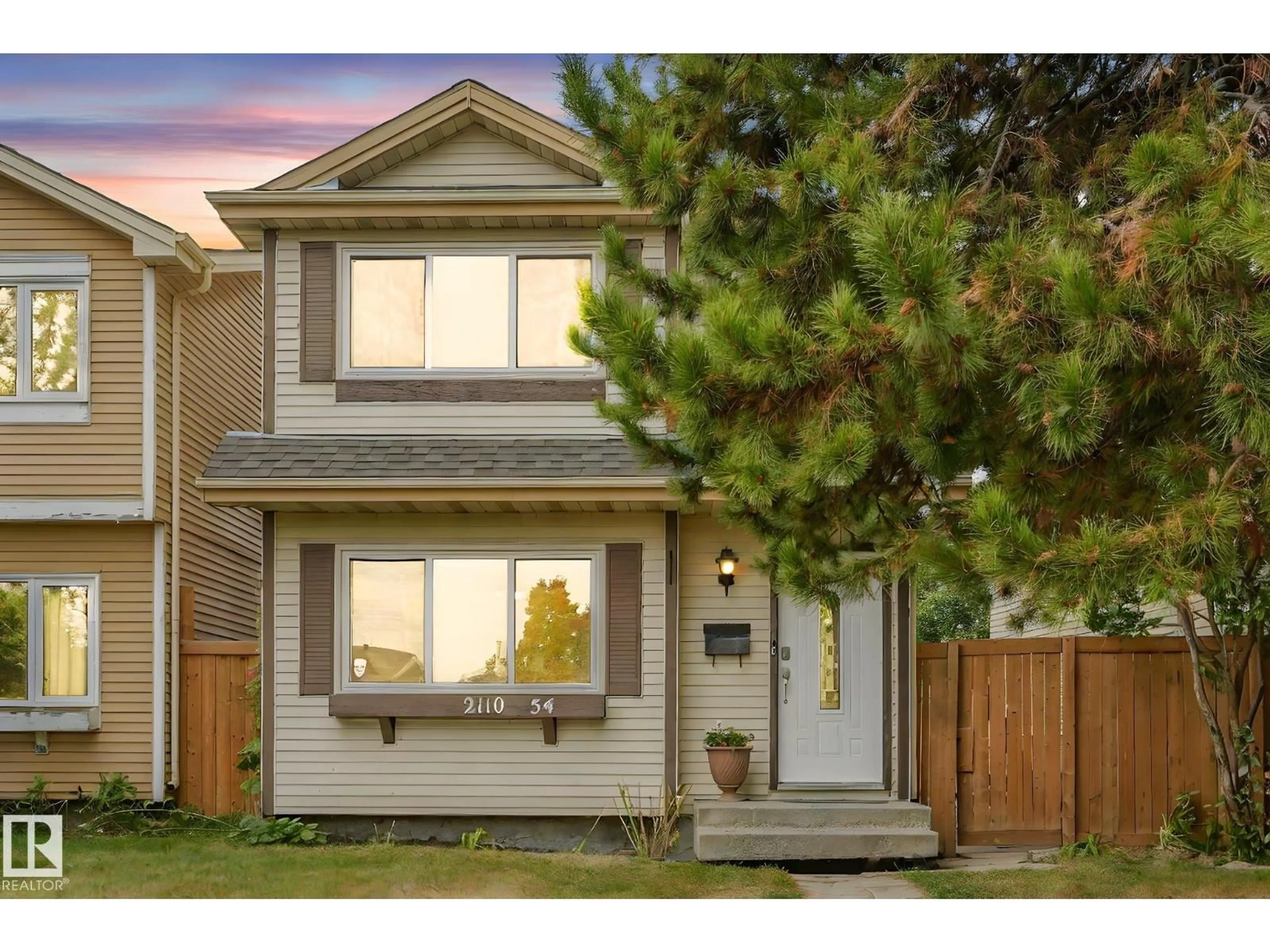 Home with vinyl exterior material, street for 2110 54 ST, Edmonton Alberta T6L4T9