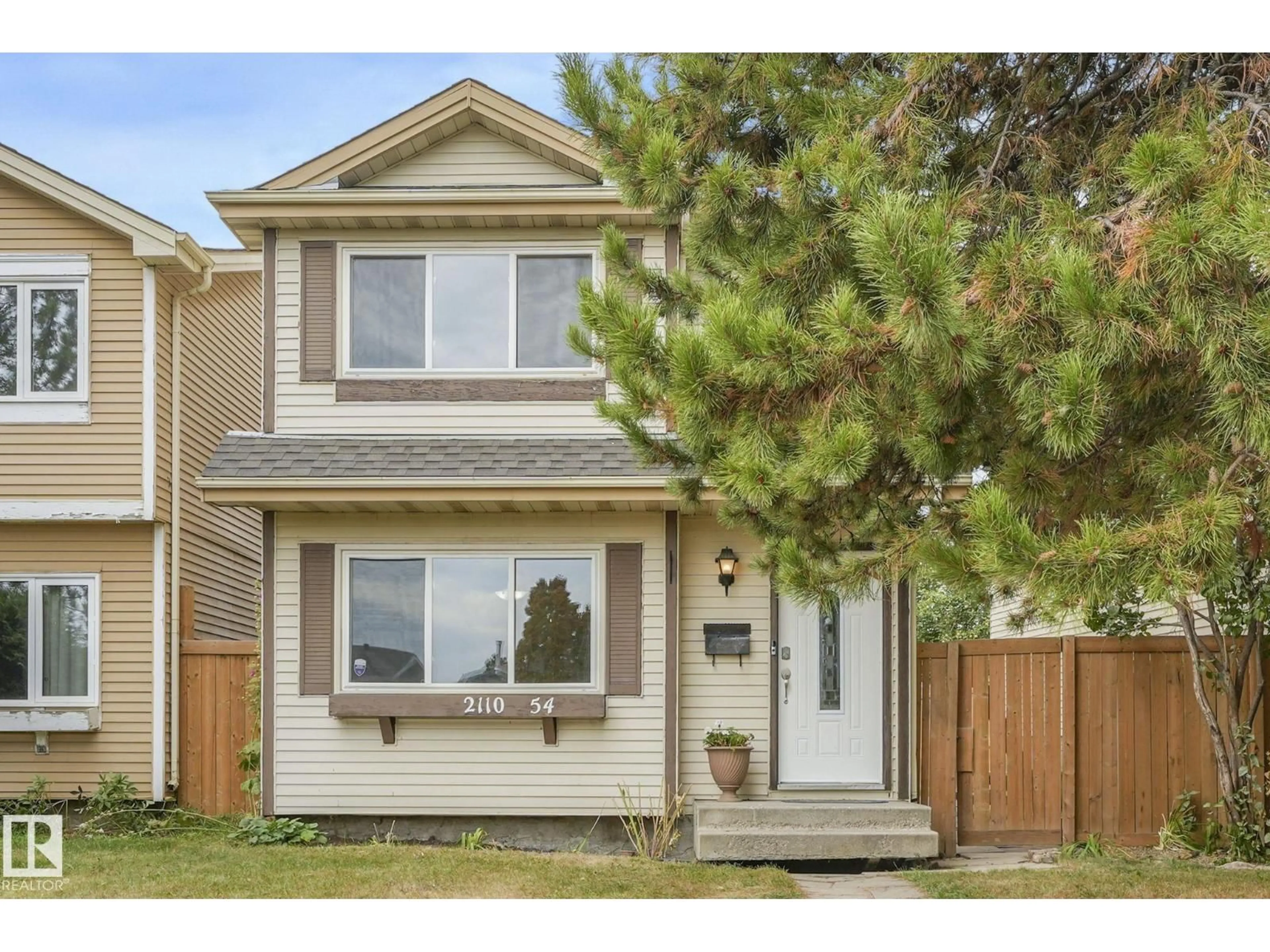 Home with vinyl exterior material, street for 2110 54 ST, Edmonton Alberta T6L4T9