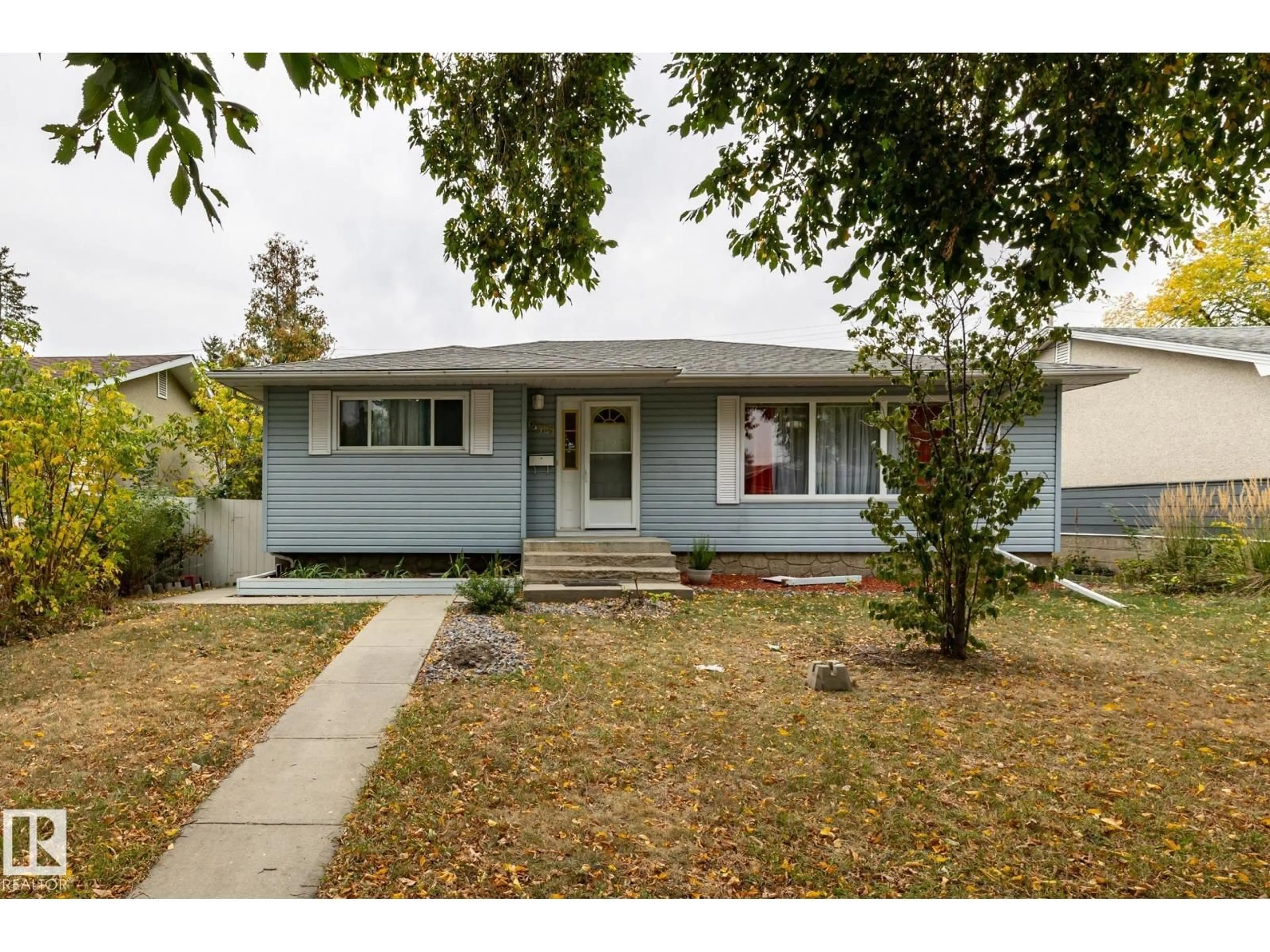 Home with vinyl exterior material, street for 15707 92 AV, Edmonton Alberta T5R5C5