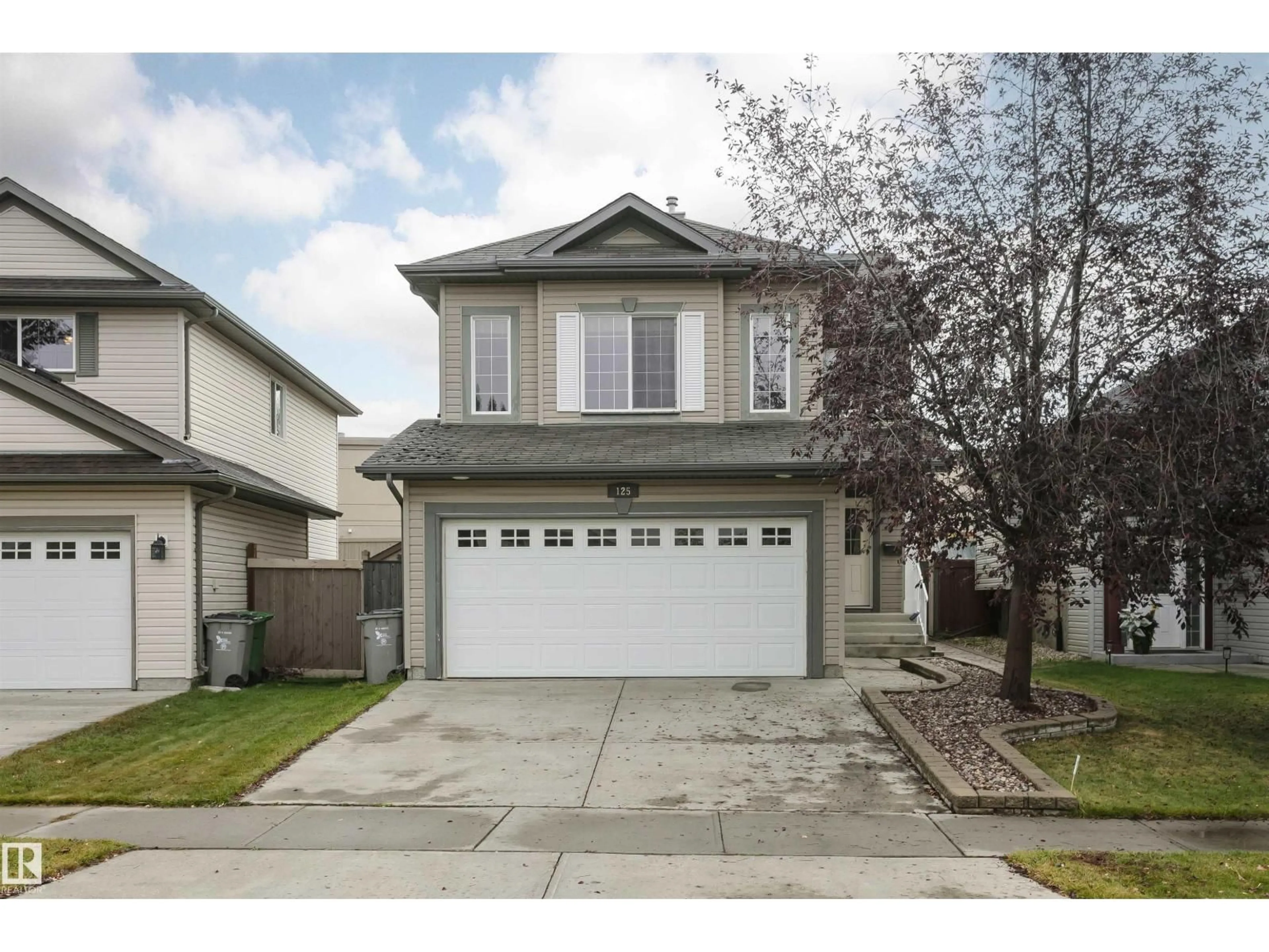 Home with vinyl exterior material, street for 125 RUE MASSON, Beaumont Alberta T4X1S8