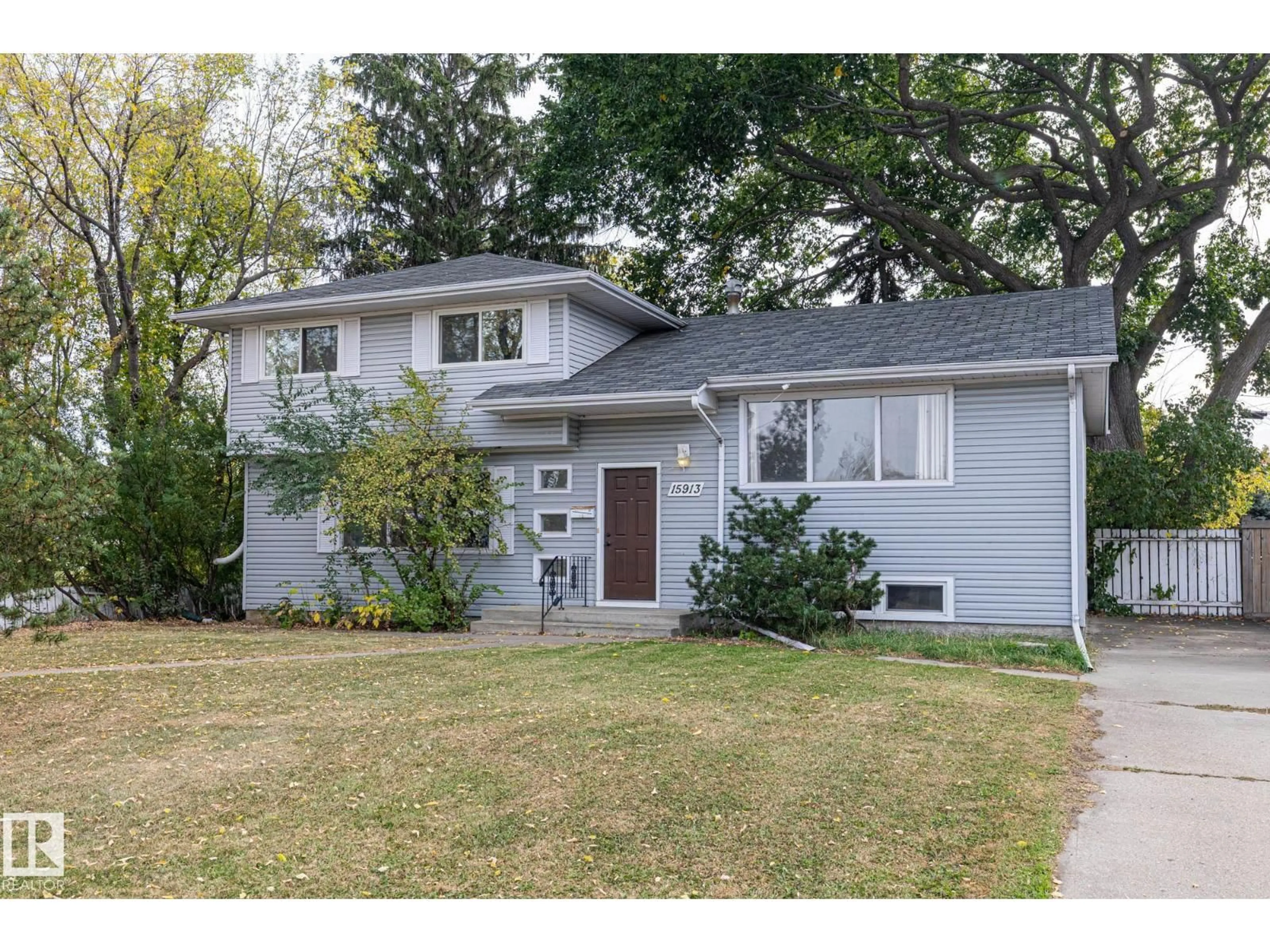 Home with vinyl exterior material, street for 15913 94 AV, Edmonton Alberta T5R5K9