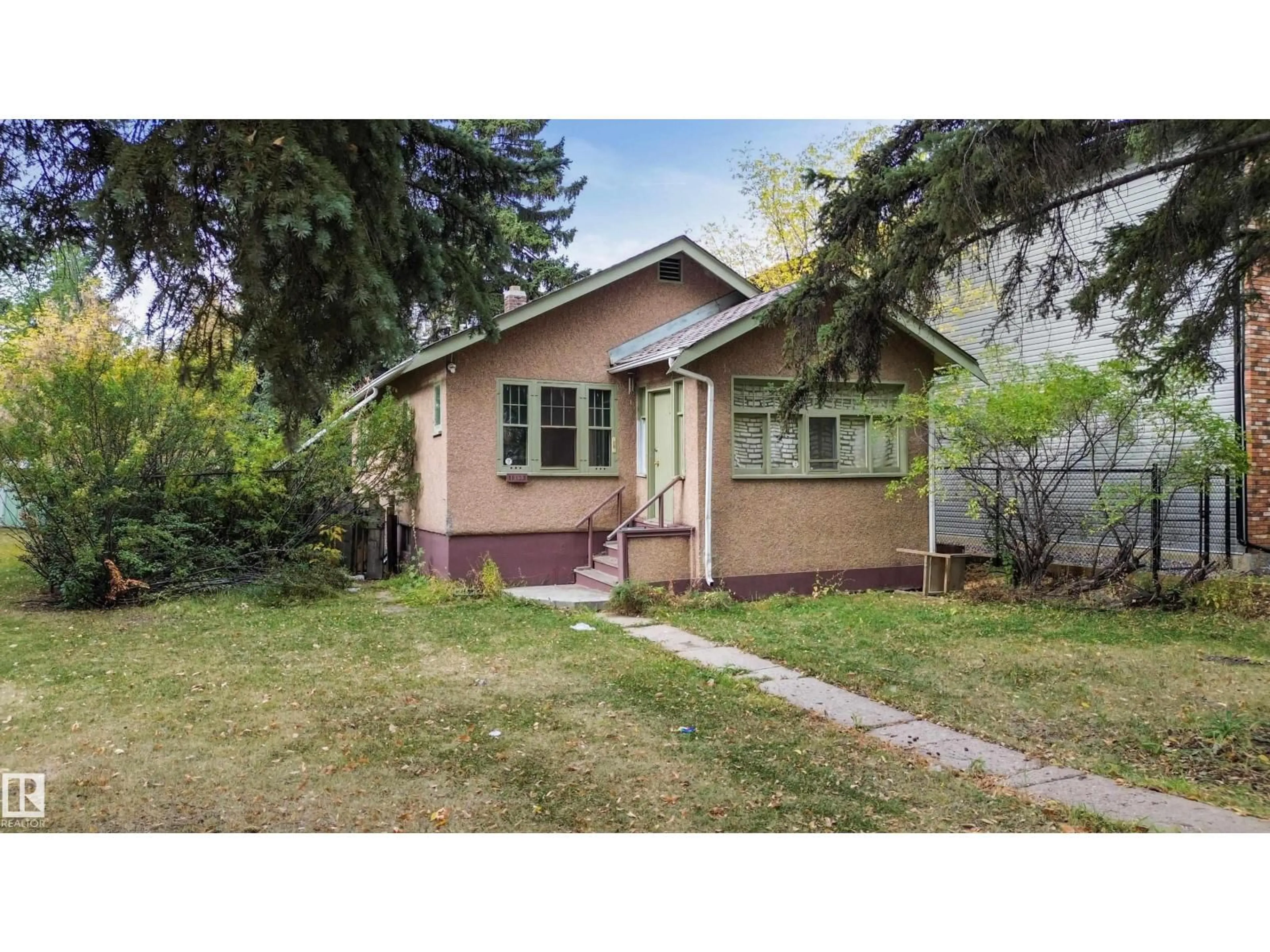 Home with vinyl exterior material, street for NW - 10822 107 ST, Edmonton Alberta T5H2Z3